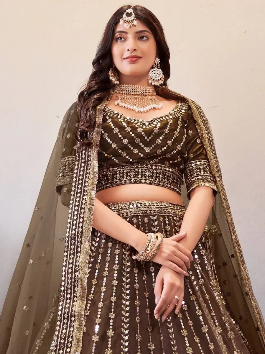 Elegant olive green lehenga choli with gold embroidery and sequins, perfect for Indian weddings and festive occasions.