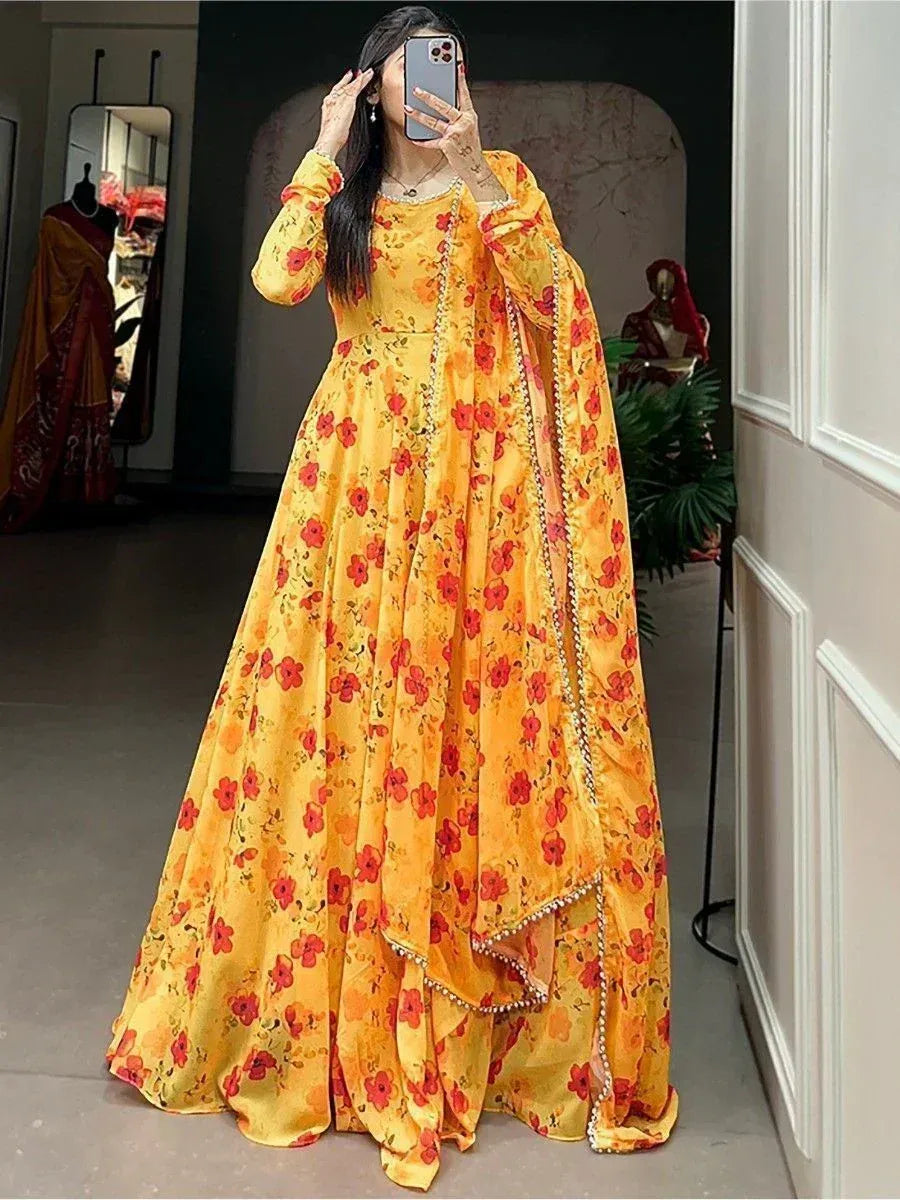 Yellow floral ethnic gown with red blooms, perfect for Indian occasions and festive wear