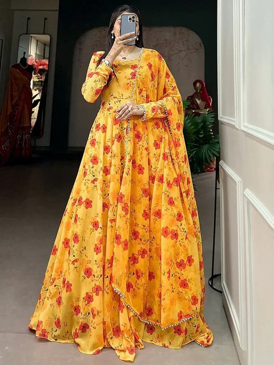 Yellow floral ethnic gown with red blooms, perfect for Indian occasions and festive wear