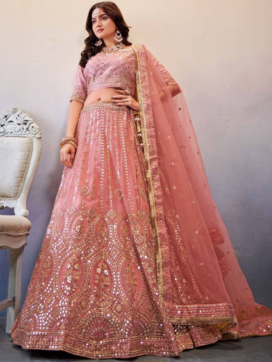 Pink designer lehenga choli with gold embroidery and mirror work, perfect for Indian weddings and festive occasions