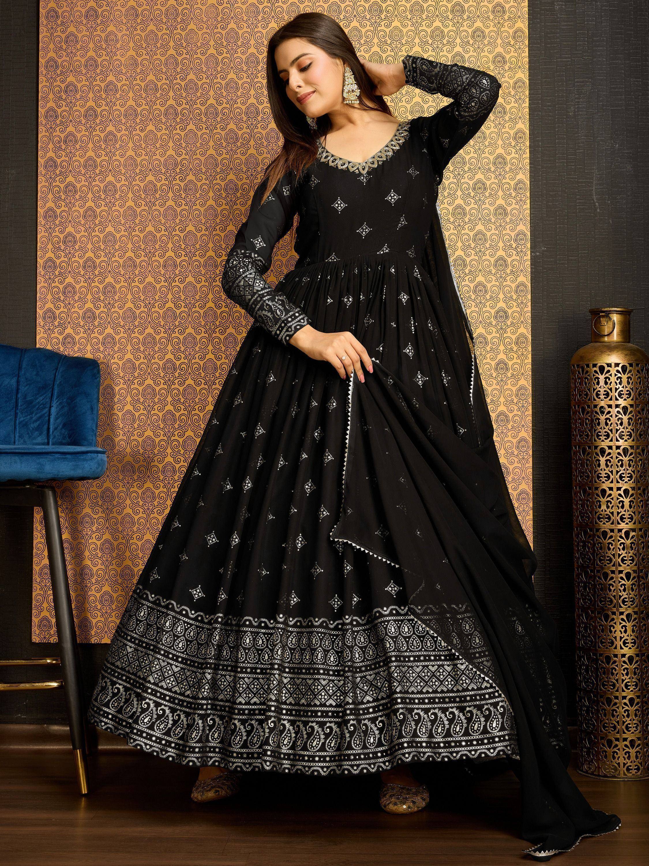 Black ethnic gown with white embroidery, perfect for Indian festive occasions and parties.