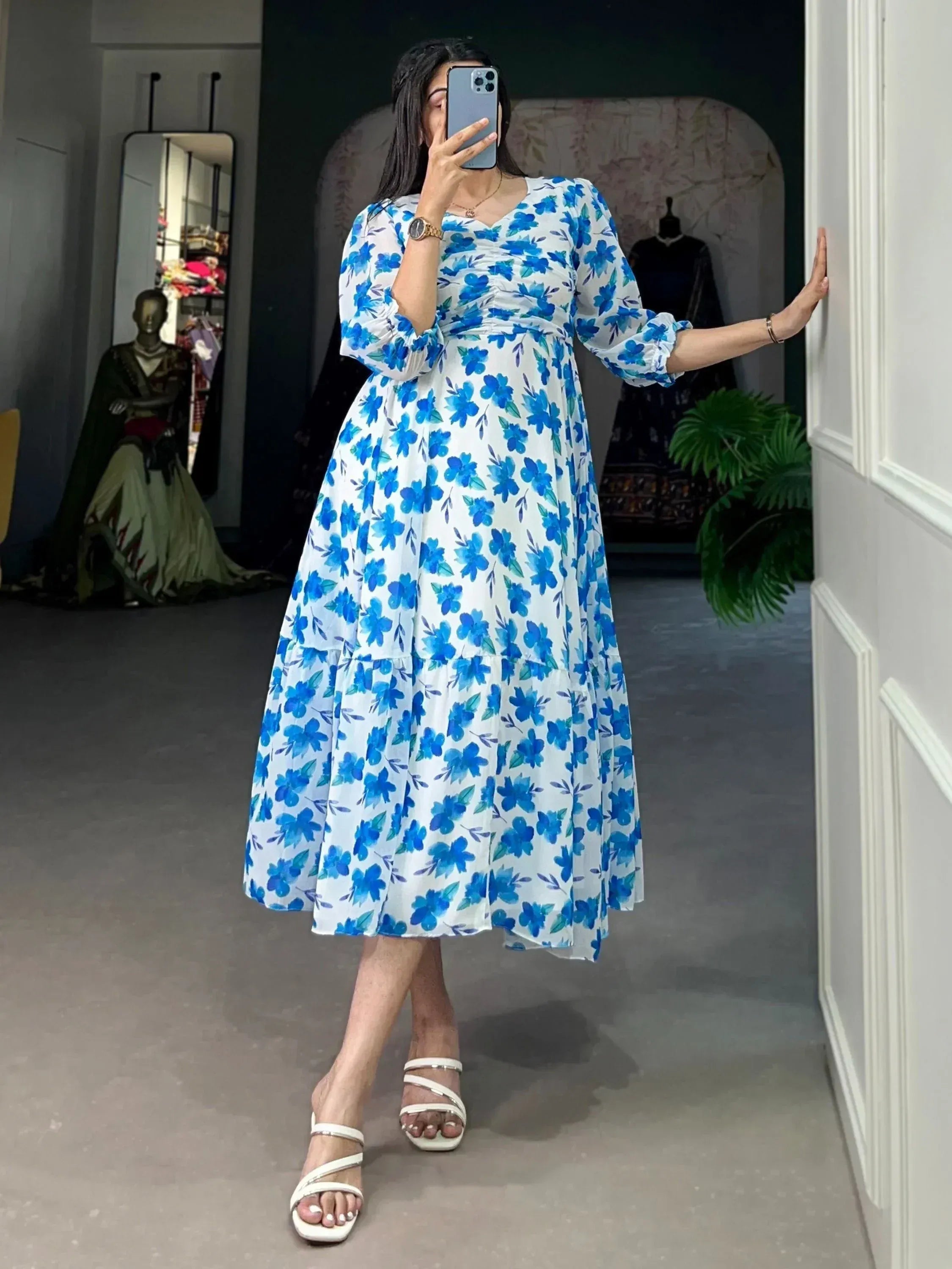 Blue floral print ethnic gown with puff sleeves, perfect for Indian occasions and festive wear.