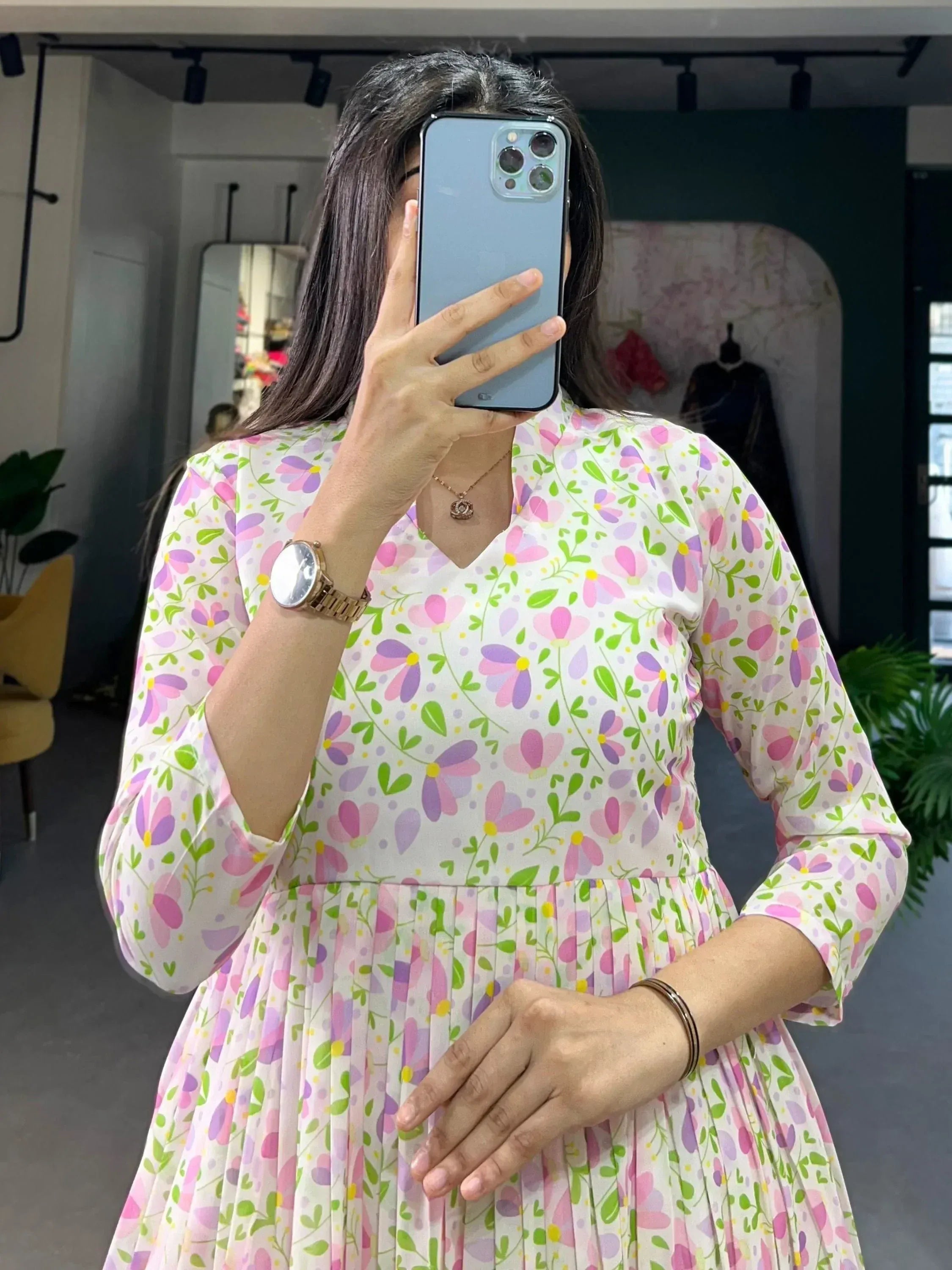 Floral print ethnic gown with pleated skirt, V-neck, and 3/4 sleeves for women