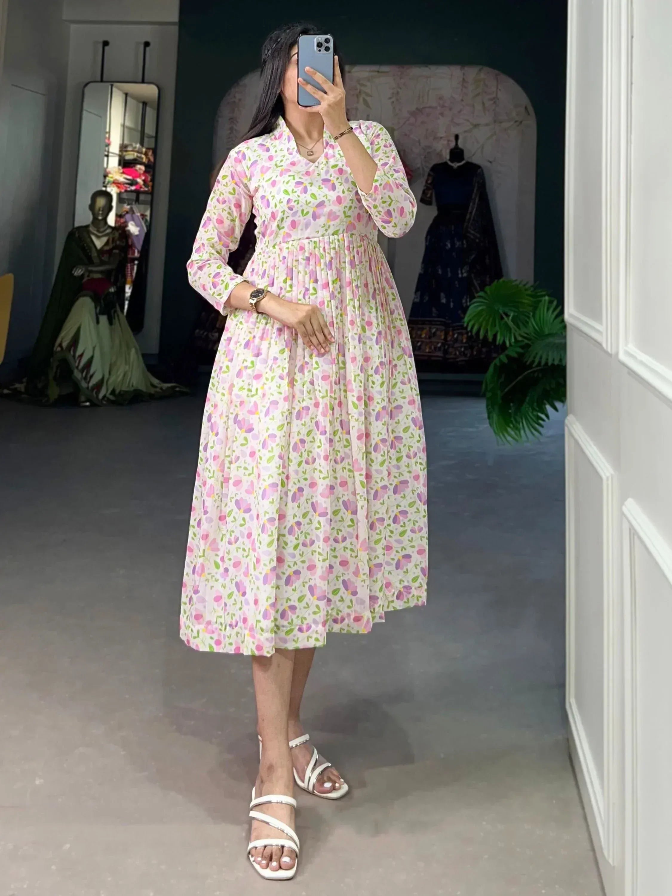 Floral print ethnic gown with pleated skirt, long sleeves, and V-neck, perfect for Indian occasions