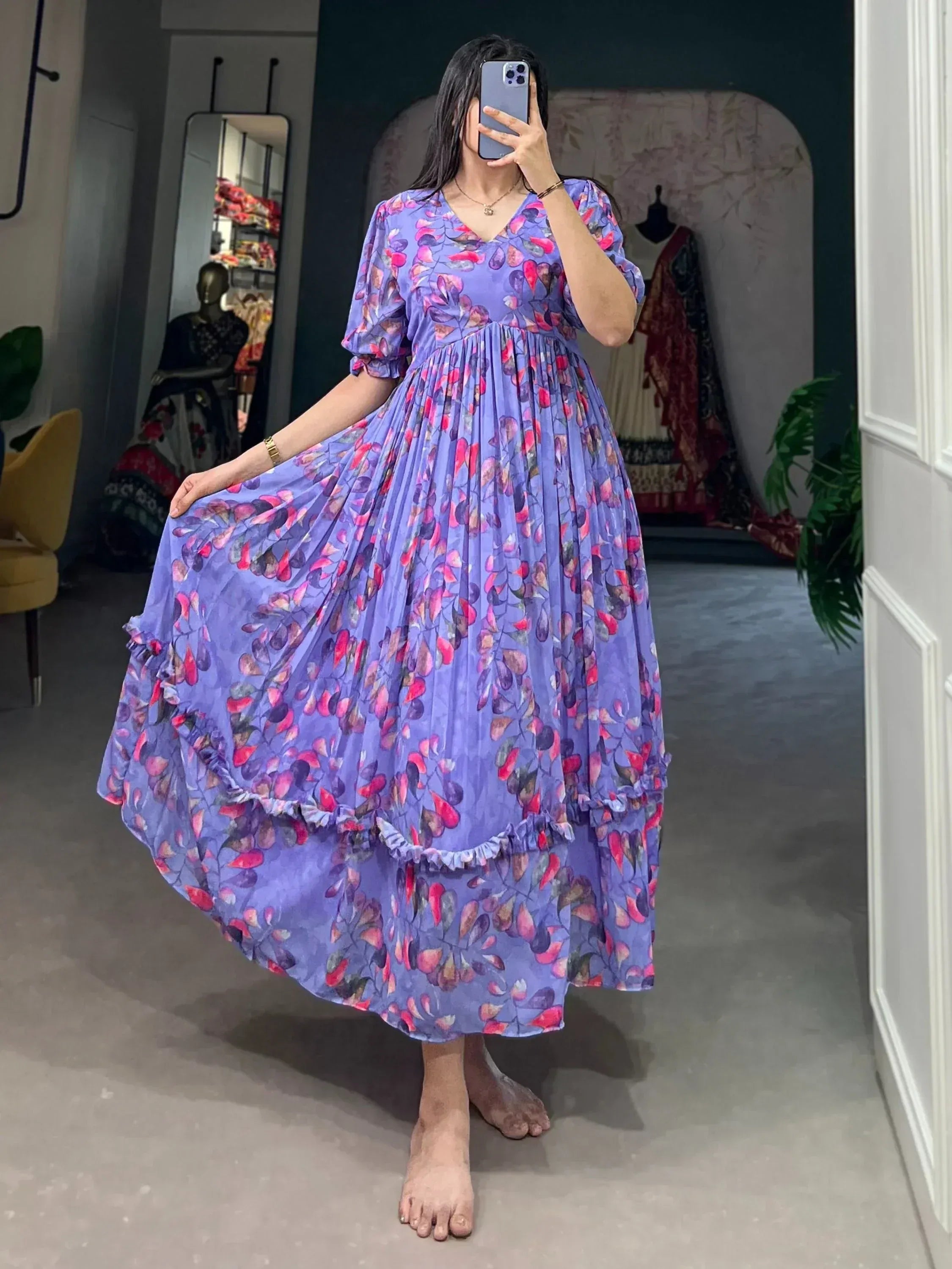 Purple floral ethnic gown with ruffled hem, perfect for festive occasions and Indian wear.