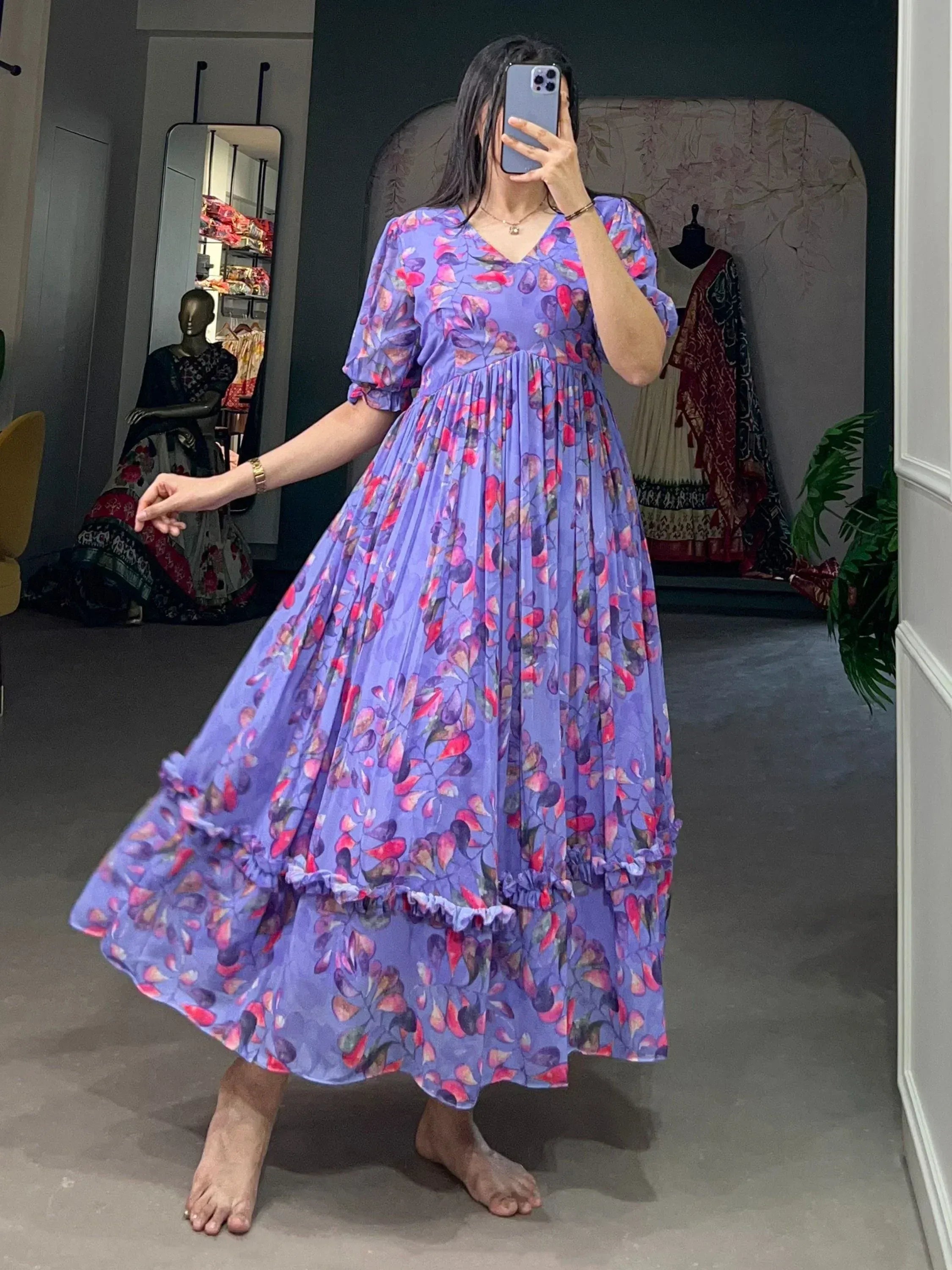 Purple floral ethnic gown with ruffled sleeves and V-neck, perfect for Indian occasions