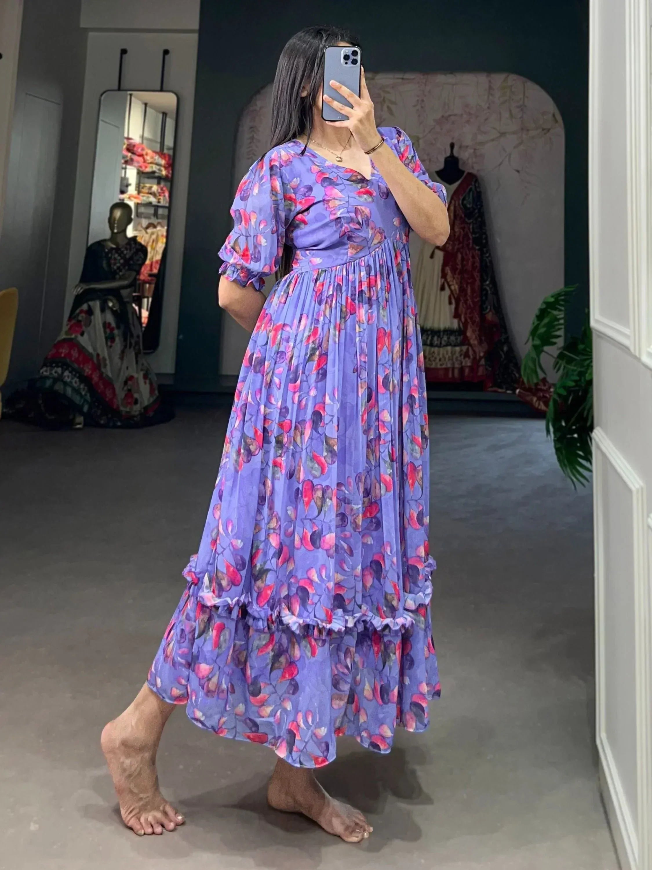 Purple floral ethnic gown with ruffled sleeves and tiered skirt, perfect for Indian occasions
