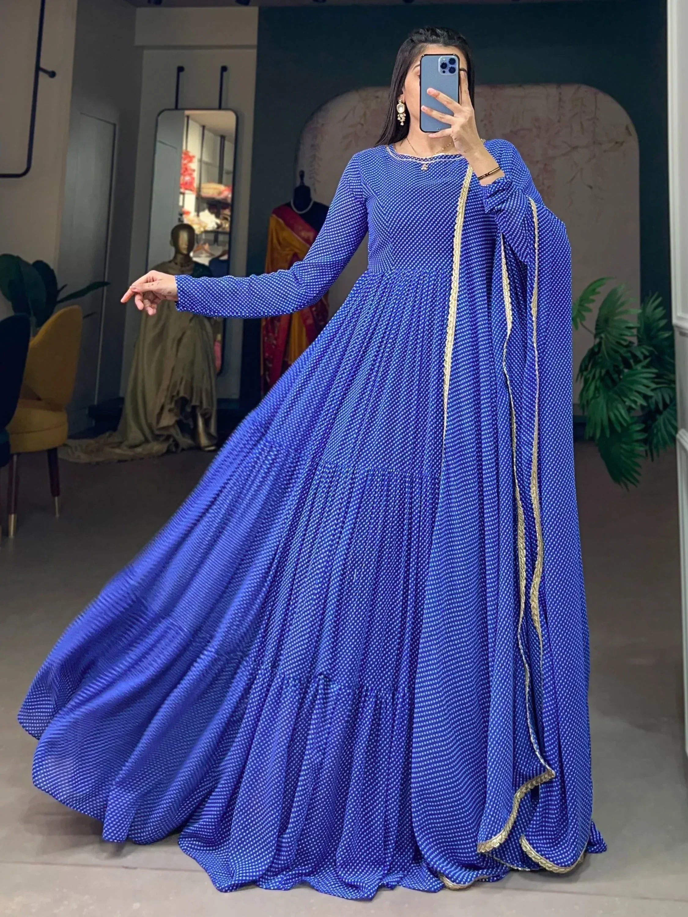Royal blue ethnic gown with white polka dots and gold trim, perfect for Indian occasions