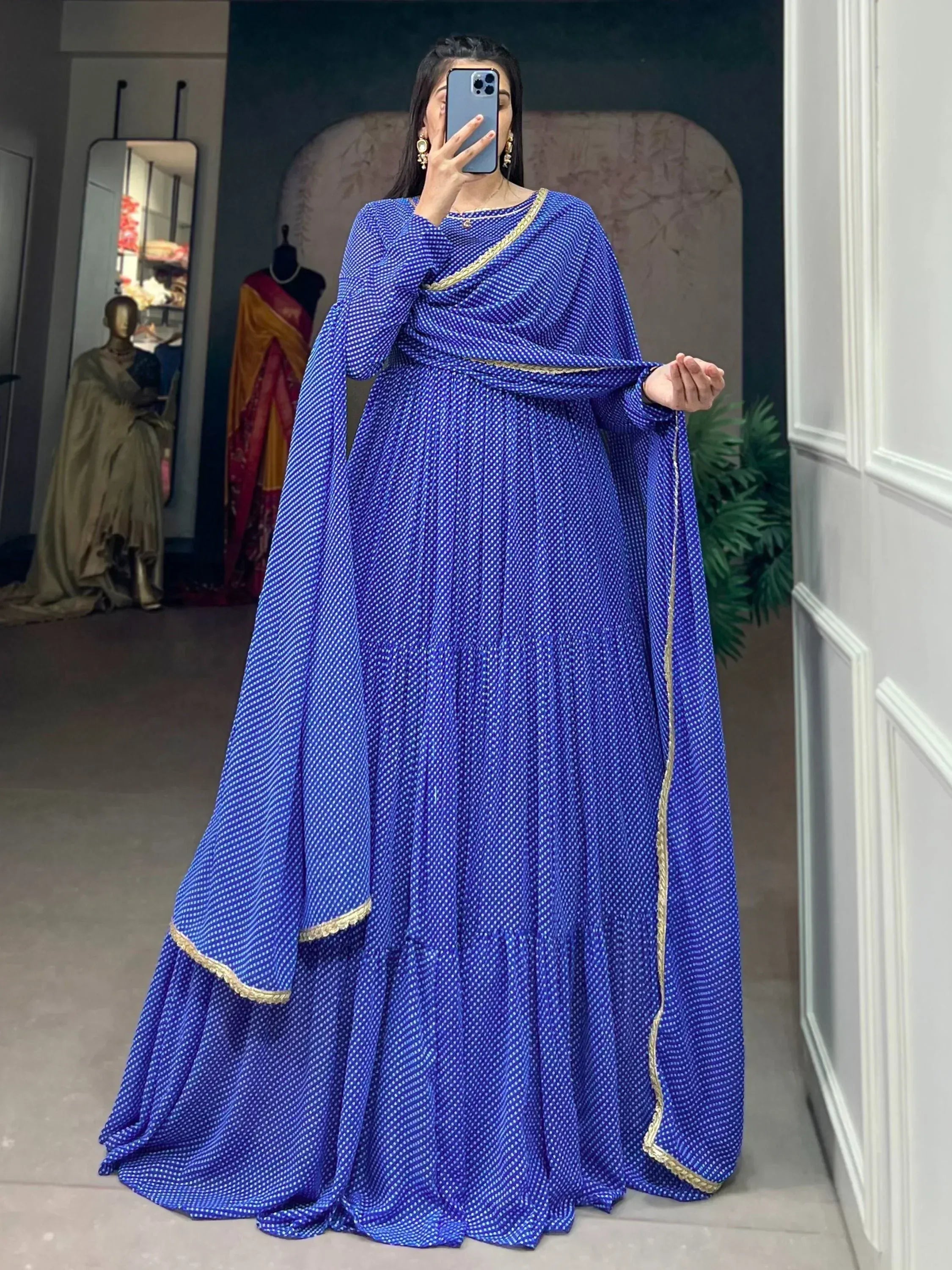 Royal blue ethnic gown with gold trim, perfect for Indian occasions and festive wear.