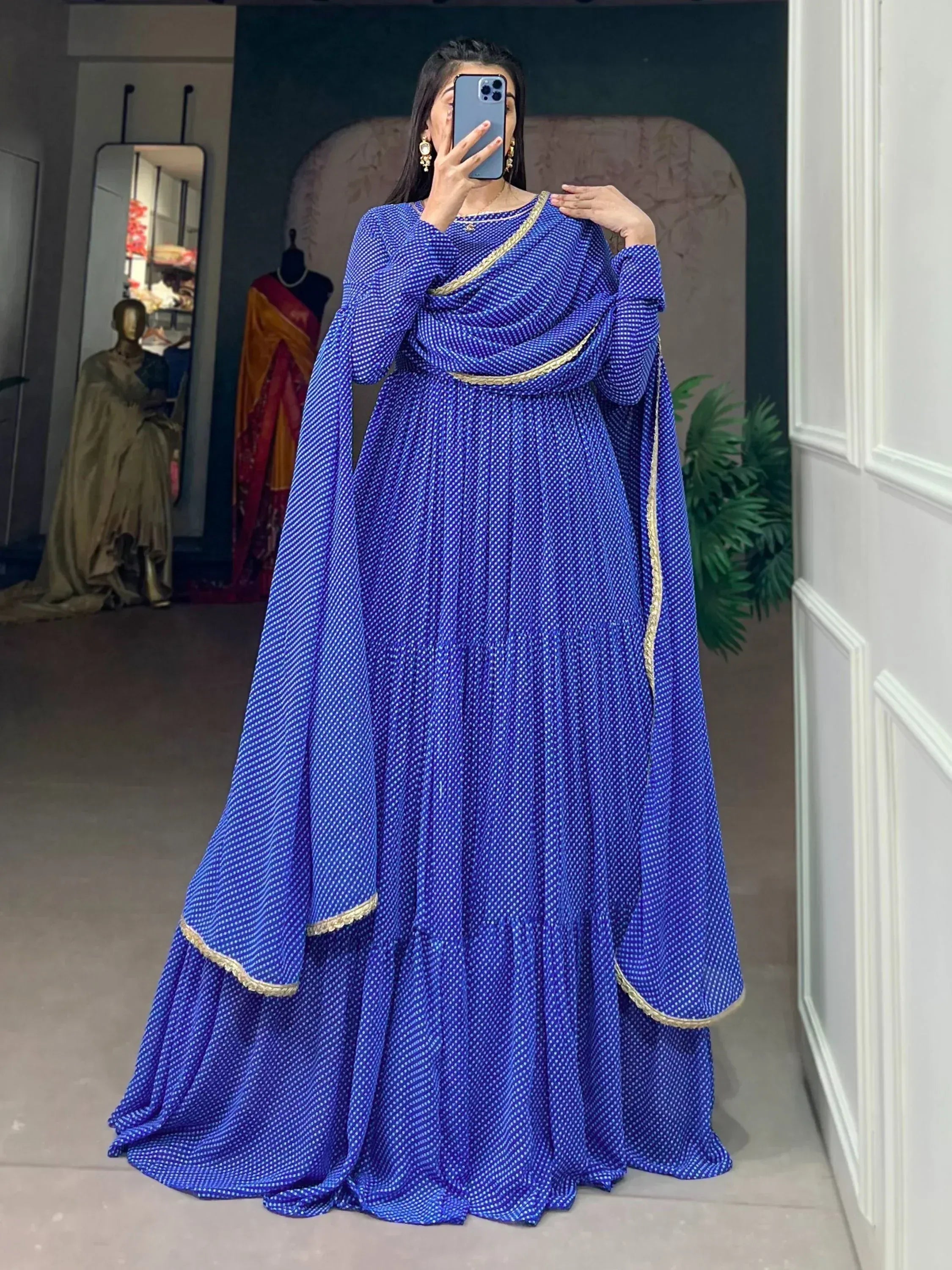 Royal blue ethnic gown with gold trim, perfect for Indian weddings or festive occasions