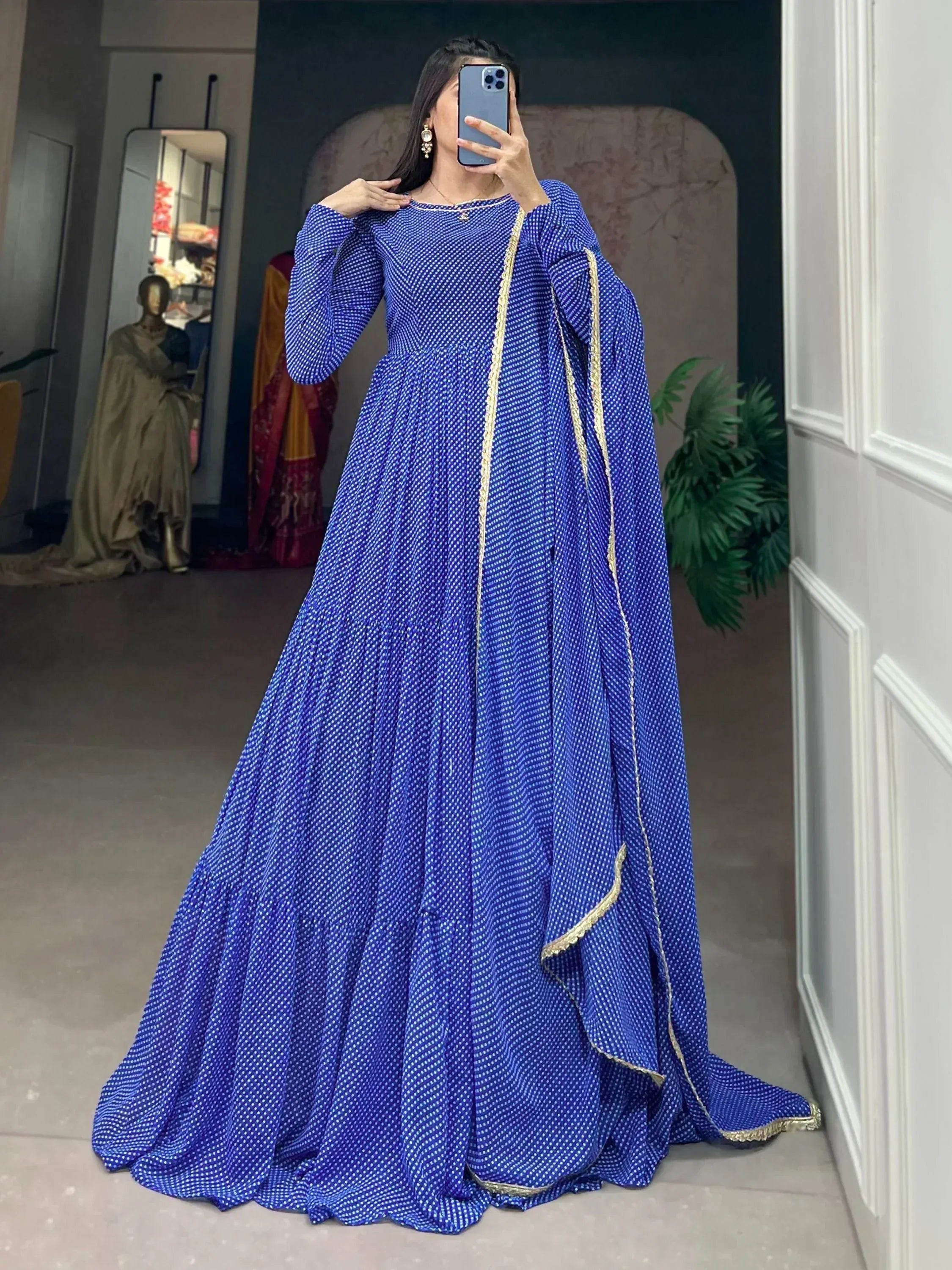 Royal blue ethnic gown with white polka dots and gold trim, perfect for Indian festive occasions