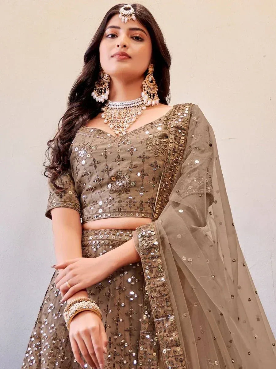 Elegant olive green designer lehenga choli with sequin embroidery and matching dupatta, perfect for Indian weddings.