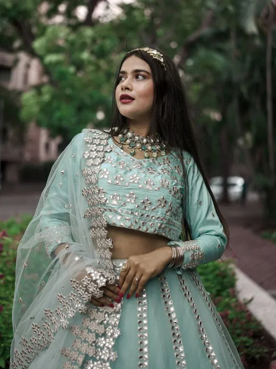 Mint green designer lehenga choli with silver embroidery, perfect for Indian ethnic wear occasions