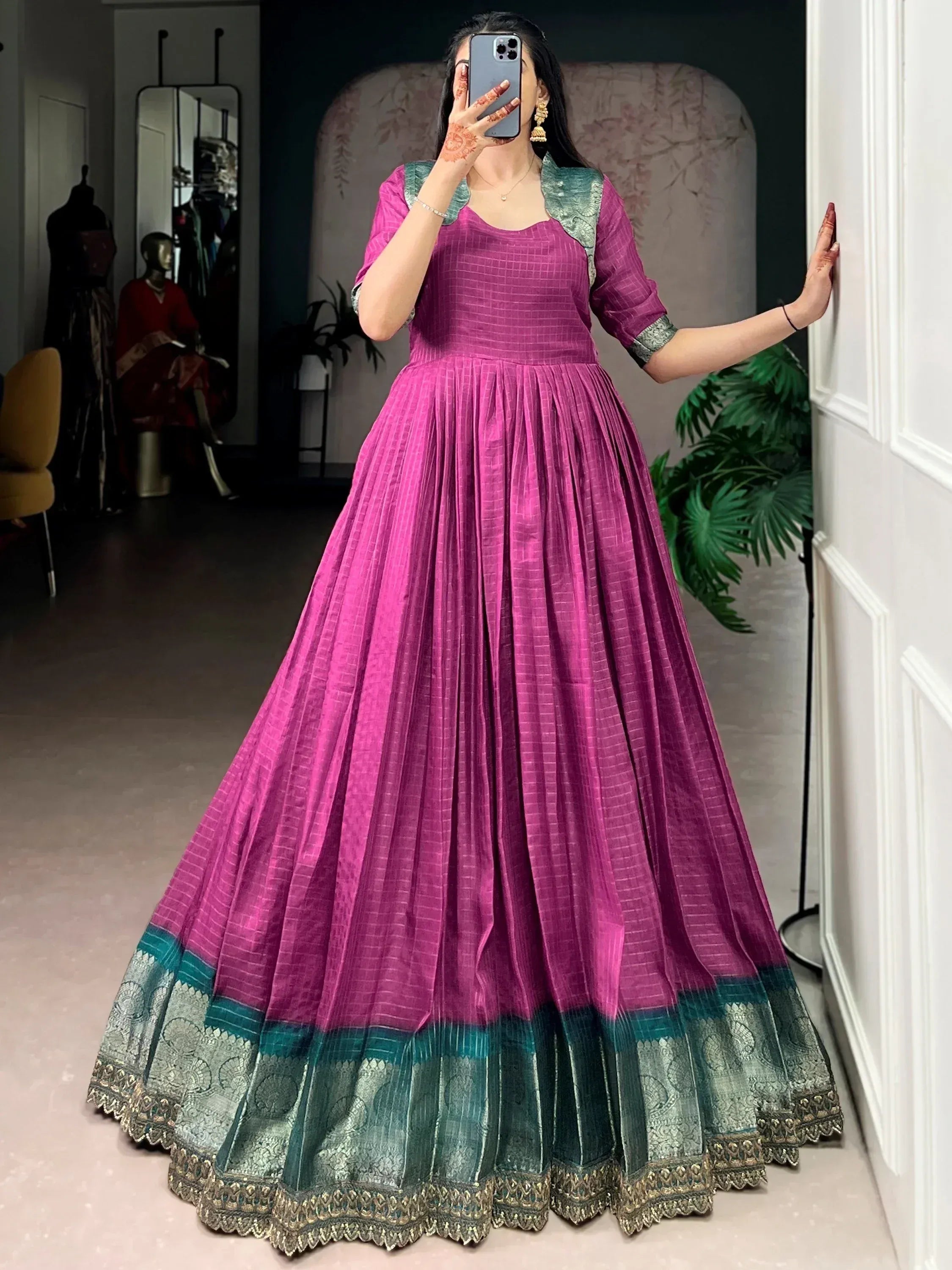 Magenta ethnic gown with teal border, perfect for Indian weddings or festive occasions