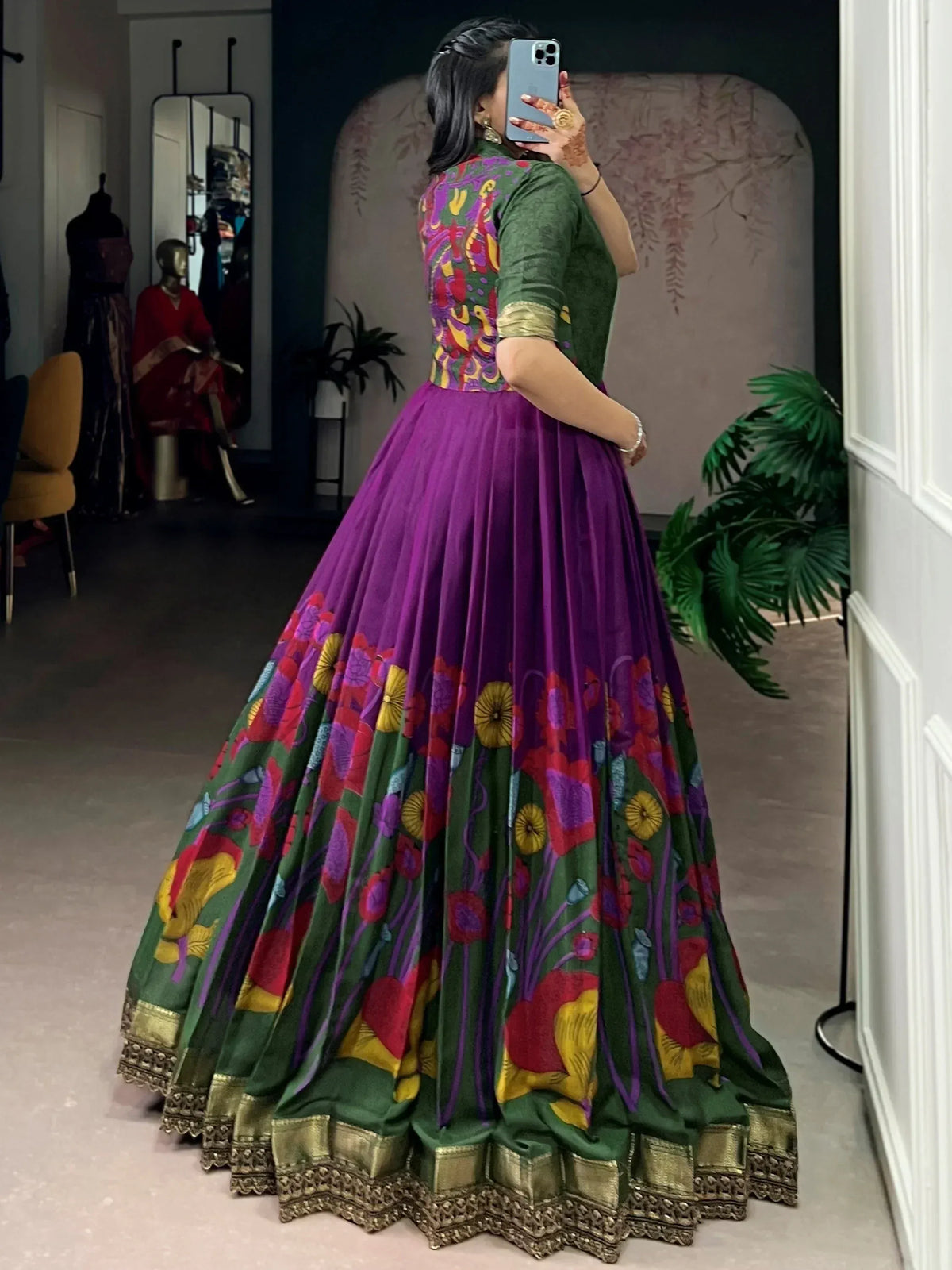 Vibrant purple and green floral print lehenga choli with gold border, perfect for Indian ethnic occasions.