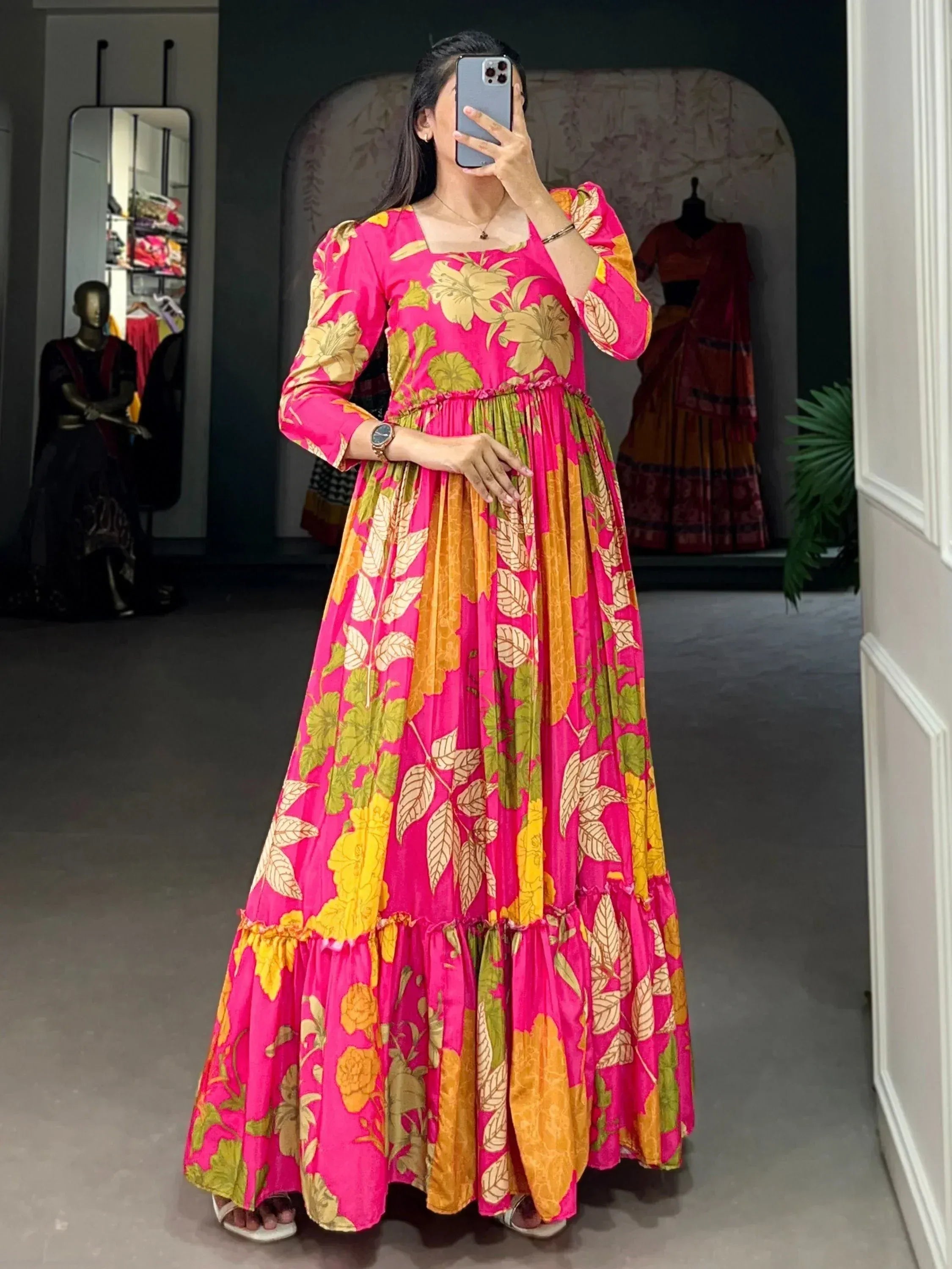 Vibrant pink floral ethnic gown with puff sleeves, perfect for festive occasions and Indian wear.