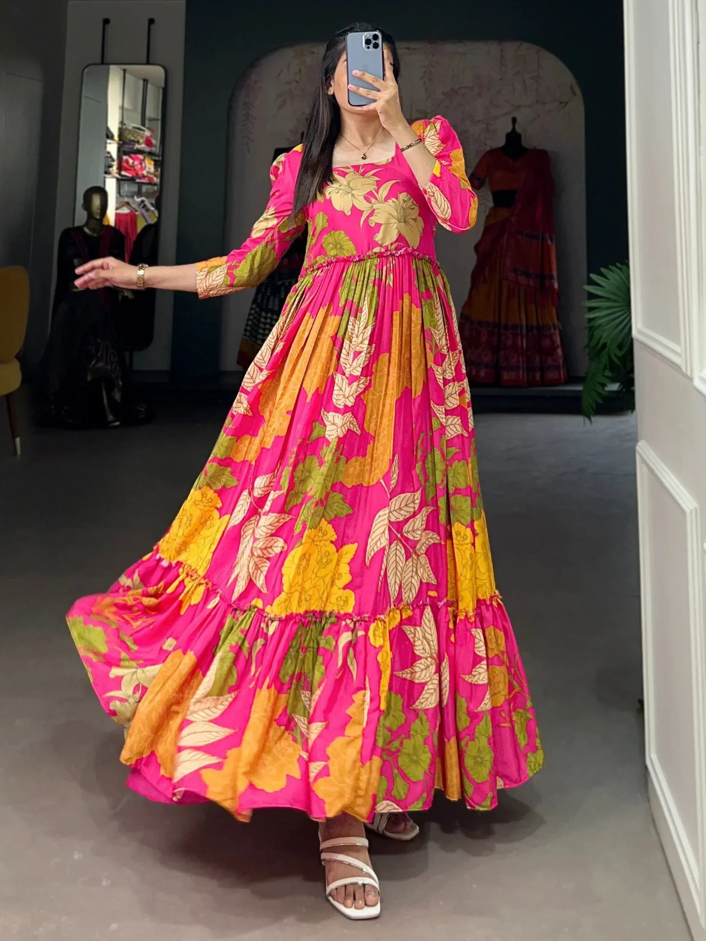 Vibrant pink floral ethnic gown with puff sleeves, perfect for festive occasions and Indian wear.