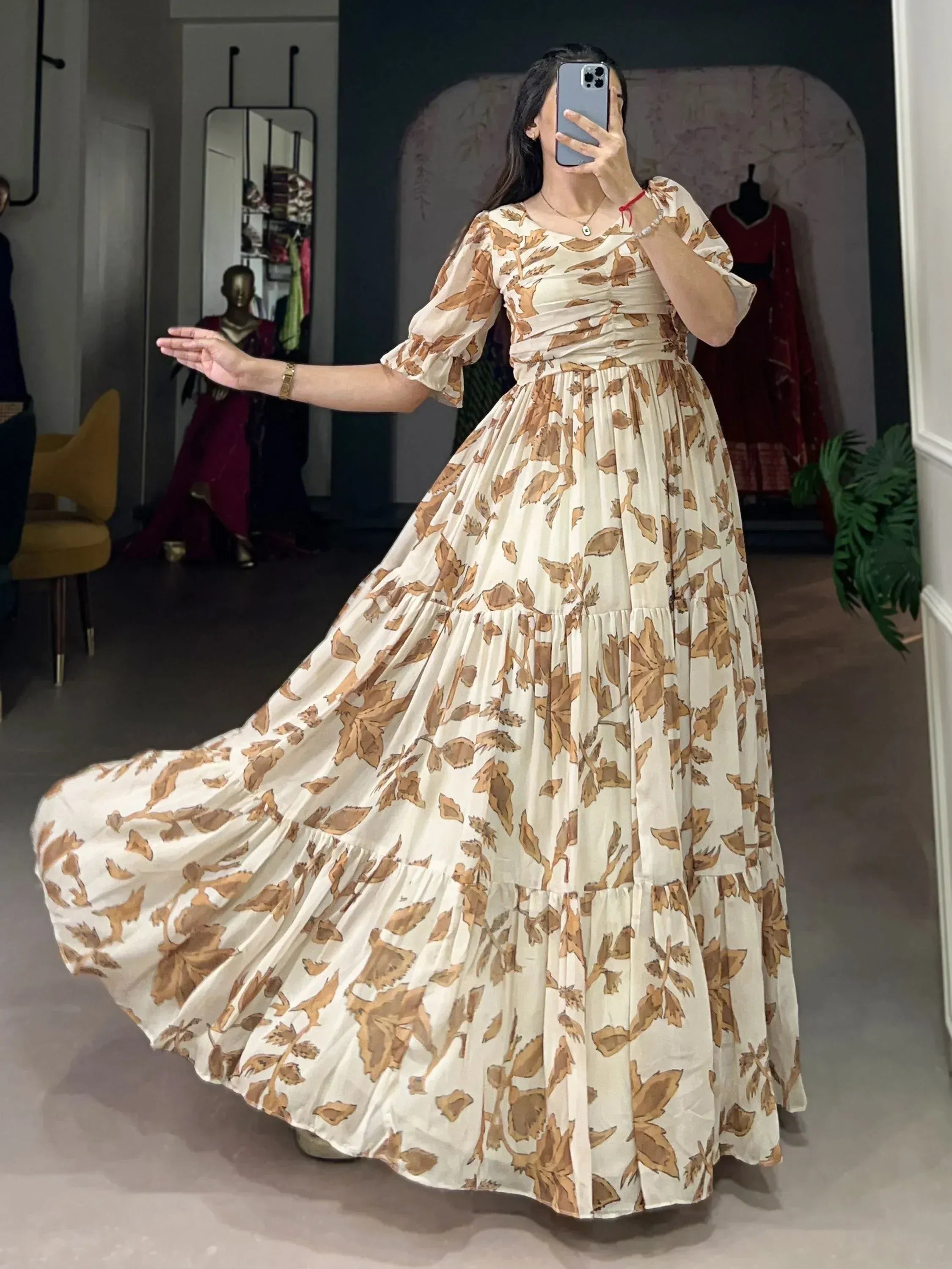 Woman posing in a beige floral ethnic gown with puff sleeves indoors