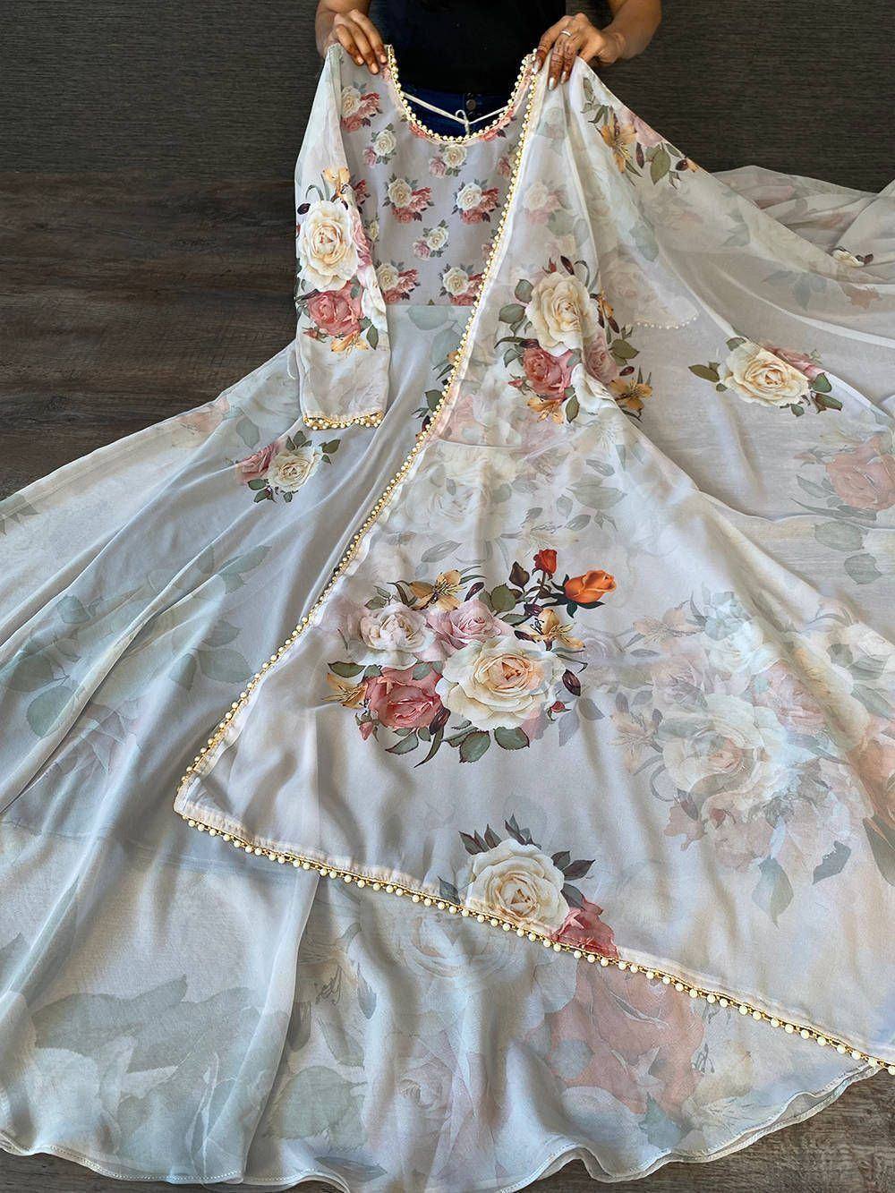 Floral print ethnic gown with gold trim, perfect for Indian occasions and festive wear.