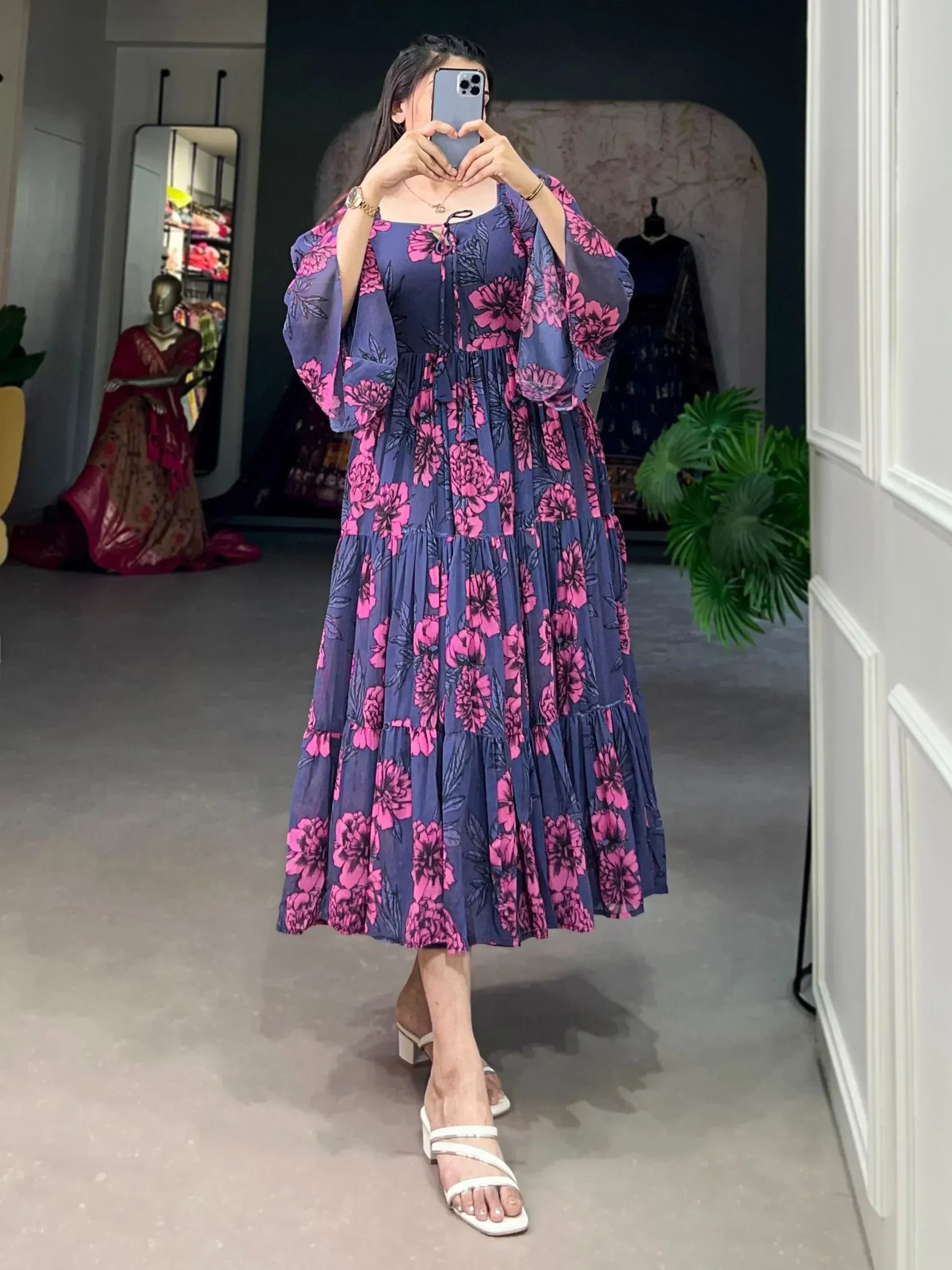 Navy blue floral ethnic gown with puff sleeves, perfect for Indian occasions and festive wear.