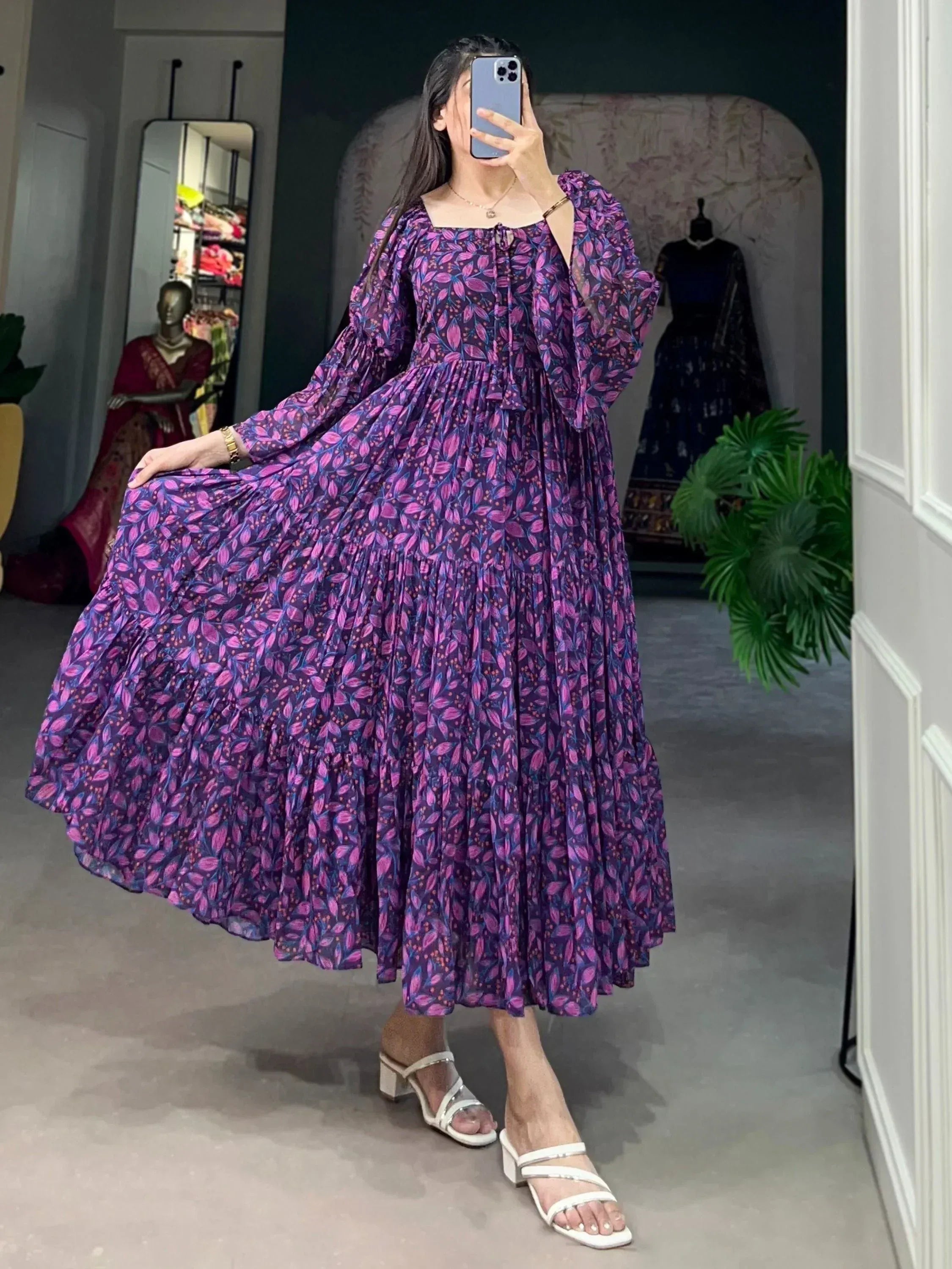 Purple floral print ethnic gown with puff sleeves and tiered skirt, perfect for Indian occasions