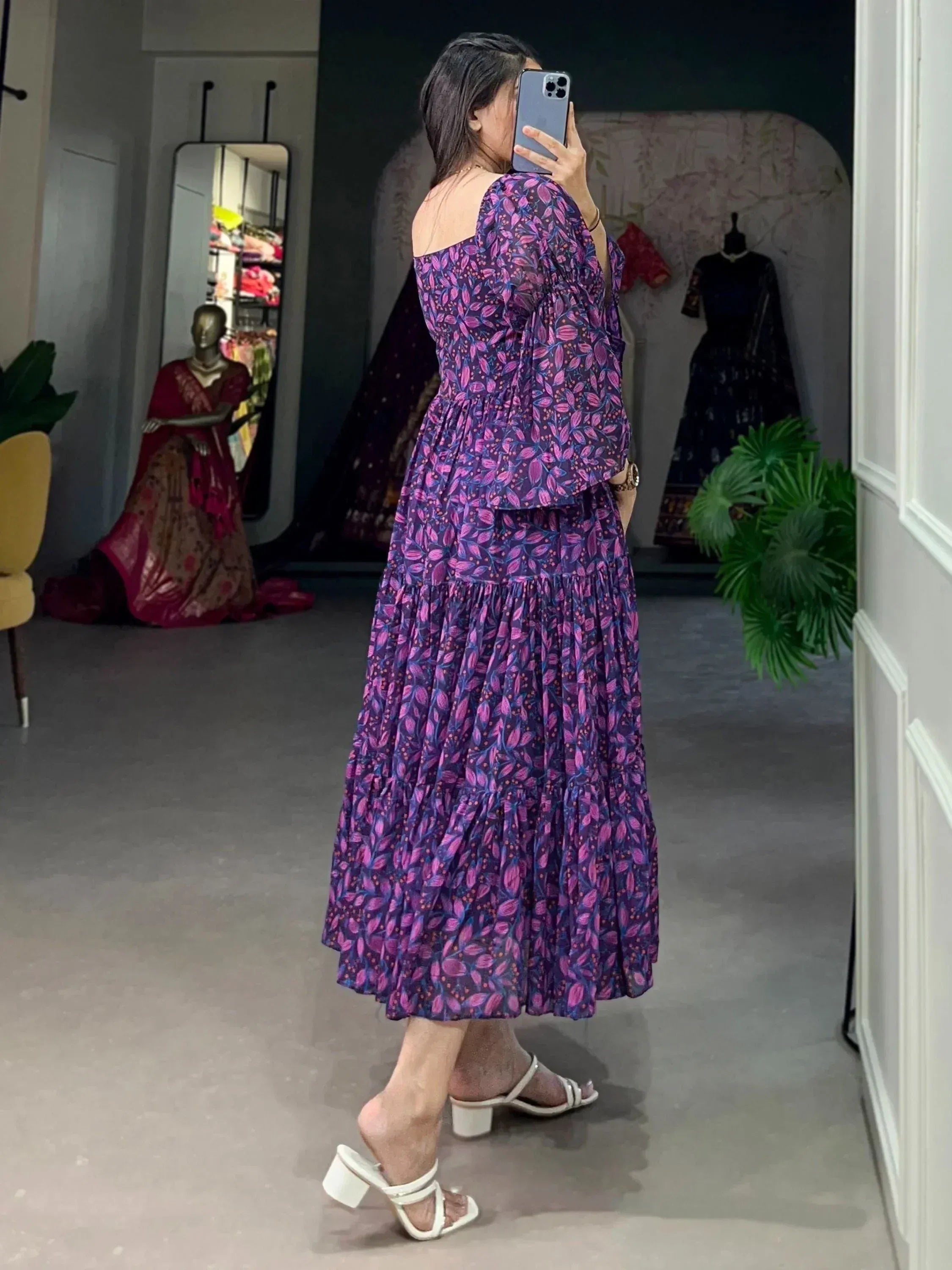 Purple floral ethnic gown with off-shoulder design, tiered skirt, perfect for Indian occasions