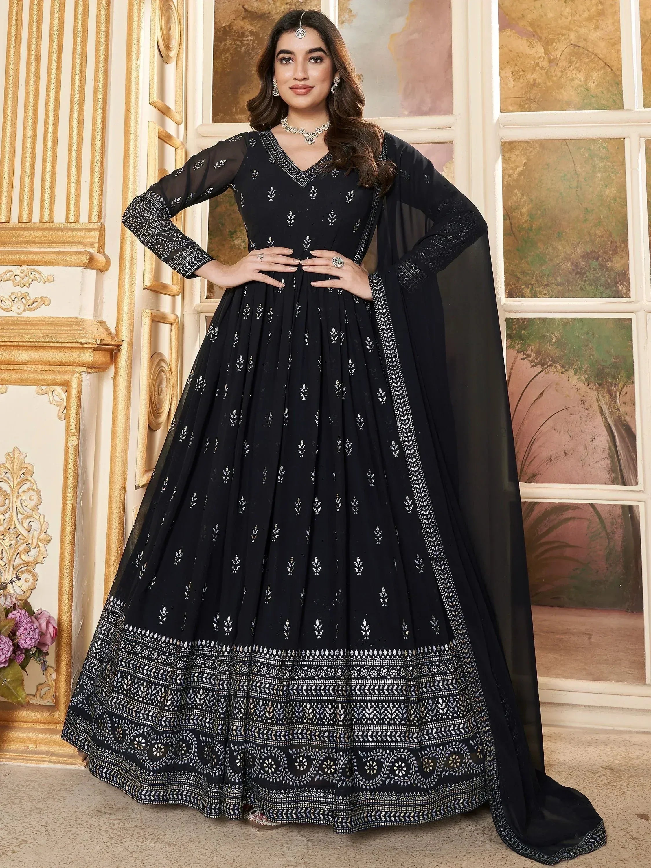 Black embroidered anarkali suit with sheer sleeves and dupatta, perfect for Indian ethnic wear occasions.