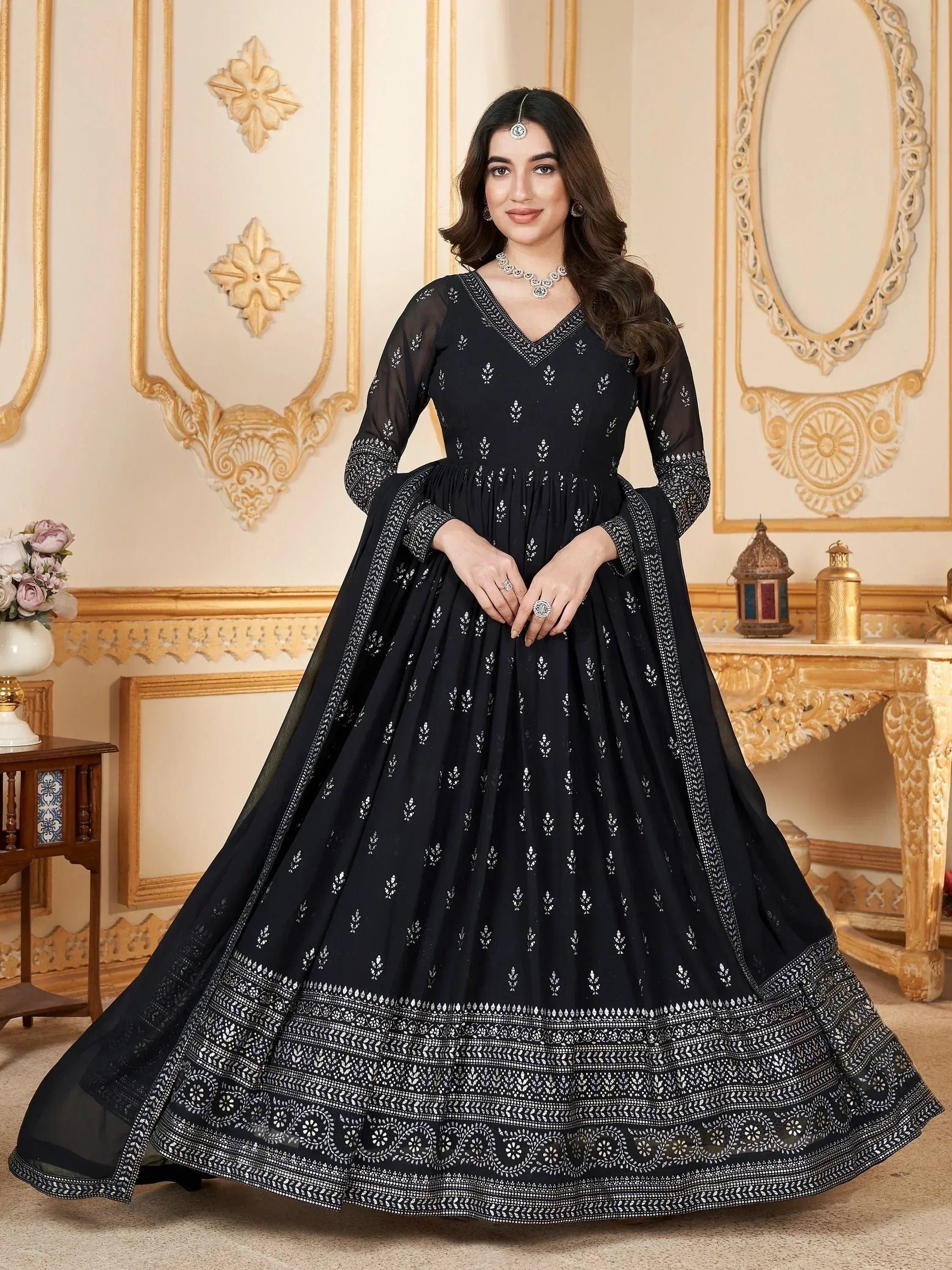 Black embroidered anarkali gown with white motifs, perfect for Indian ethnic wear and festive occasions.
