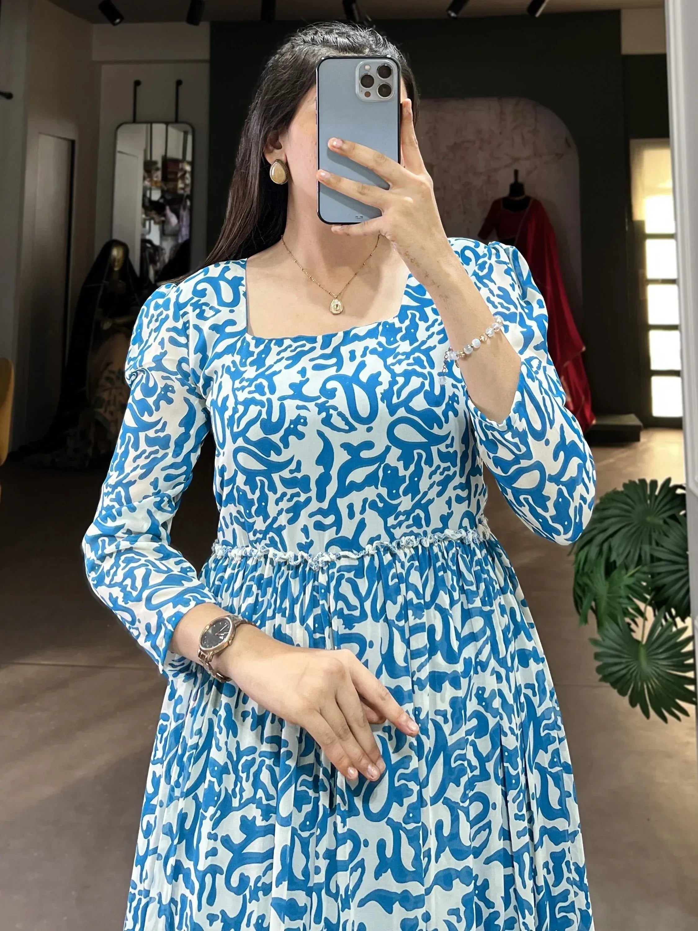 Blue and white printed ethnic gown with puff sleeves and square neck