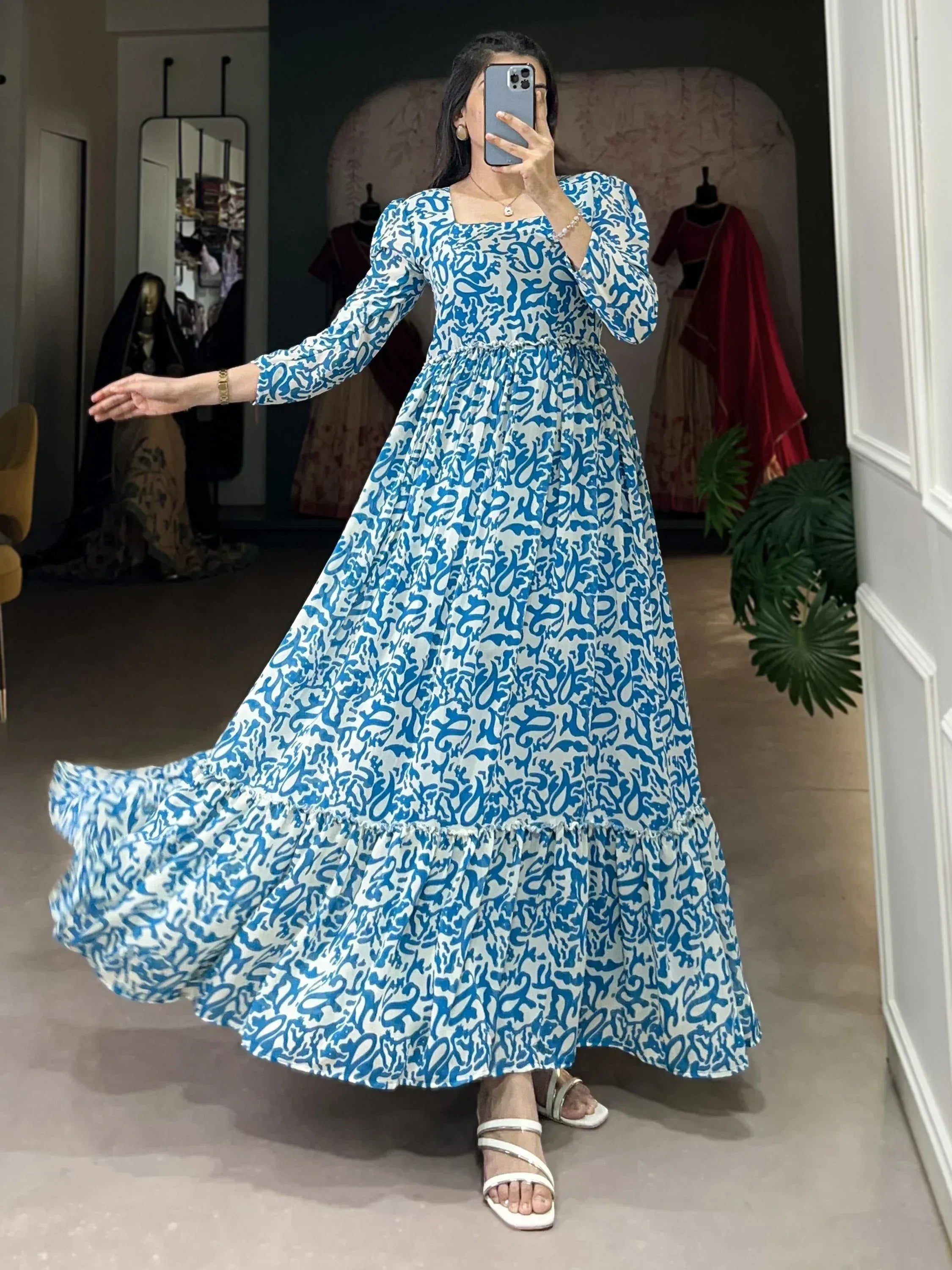 Blue and white printed ethnic gown with flared skirt, perfect for Indian festive occasions.