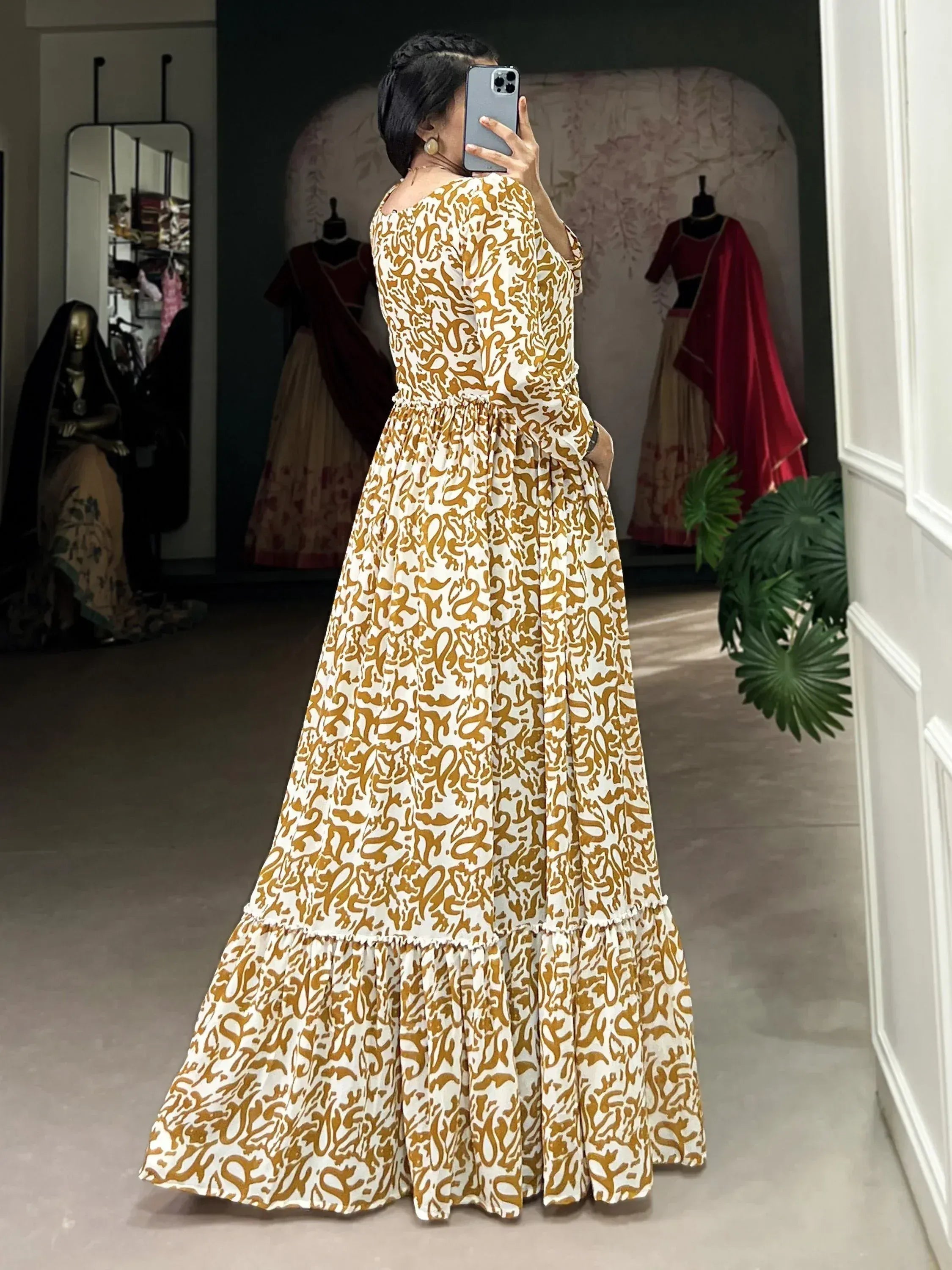 Elegant ethnic gown with gold print, tiered skirt, perfect for Indian occasions
