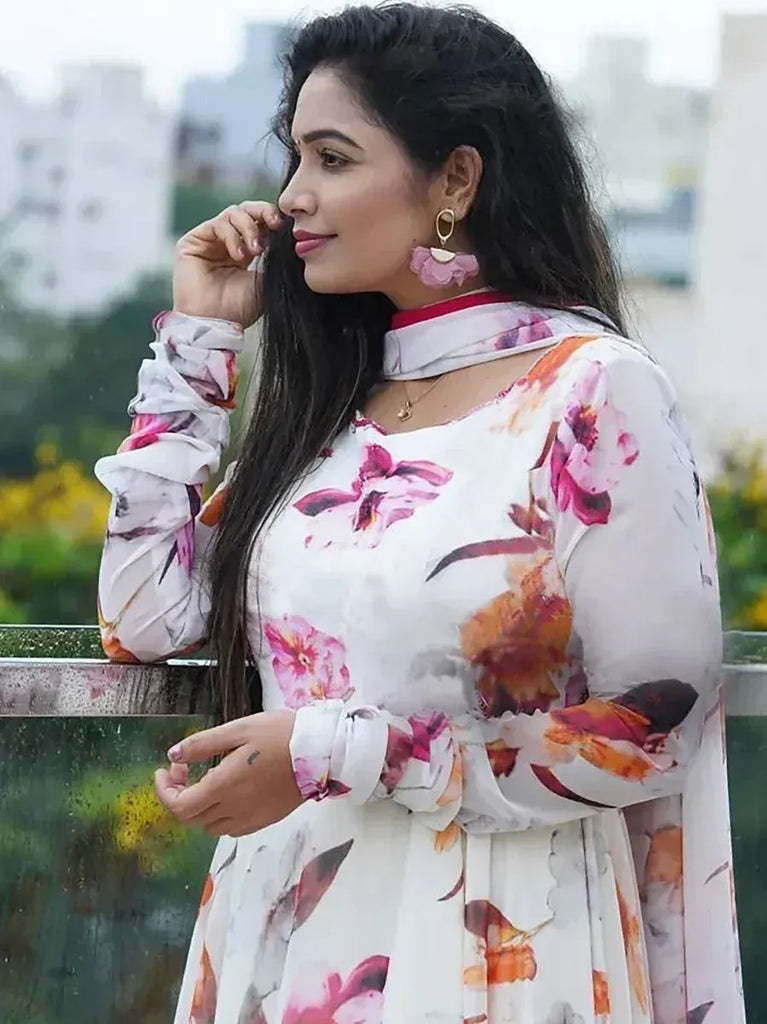 Woman in floral print ethnic gown with ruffled sleeves, perfect for Indian occasions