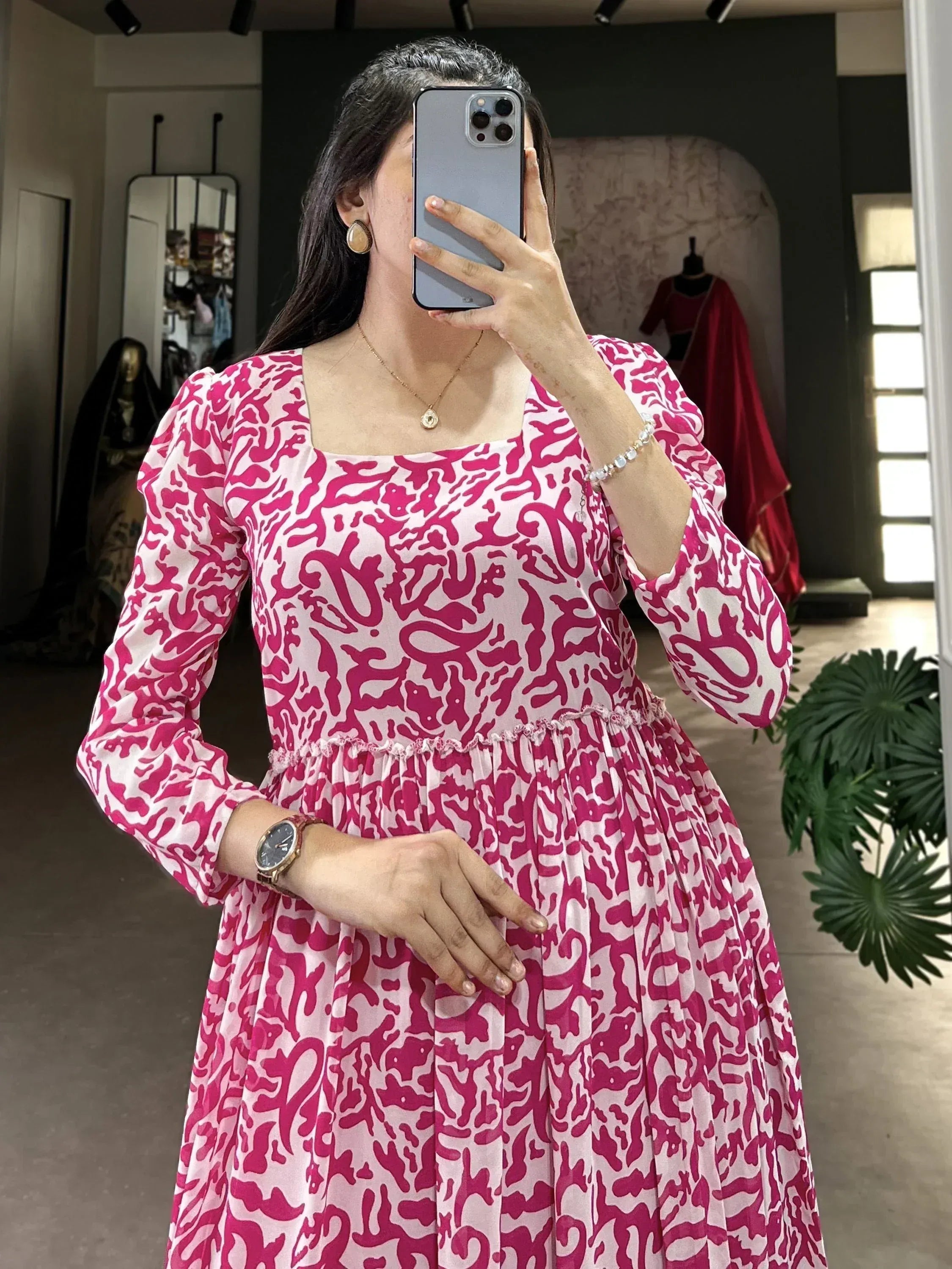 Pink and white abstract print ethnic gown with puff sleeves and square neck, perfect for festive occasions.