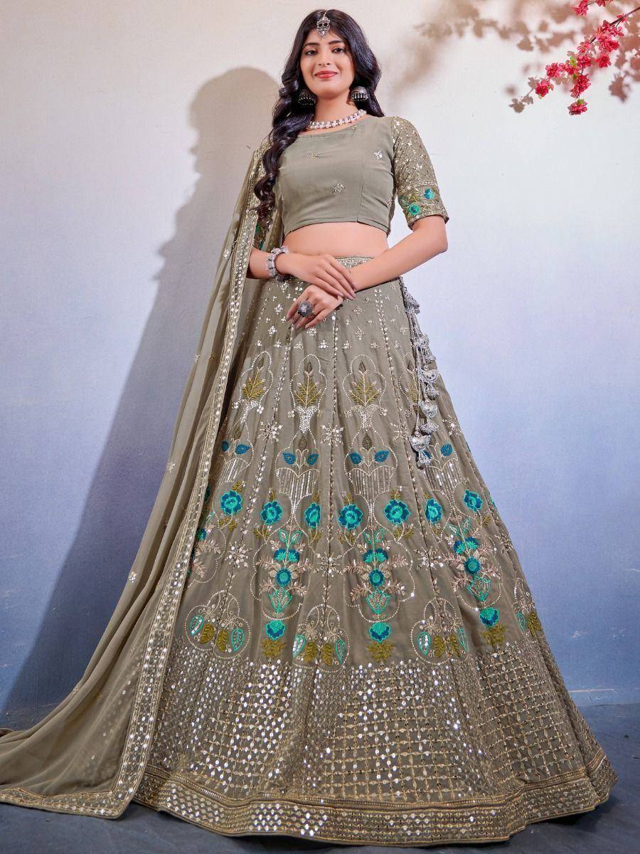Olive green designer lehenga choli with floral embroidery and mirror work, perfect for weddings and festive occasions.