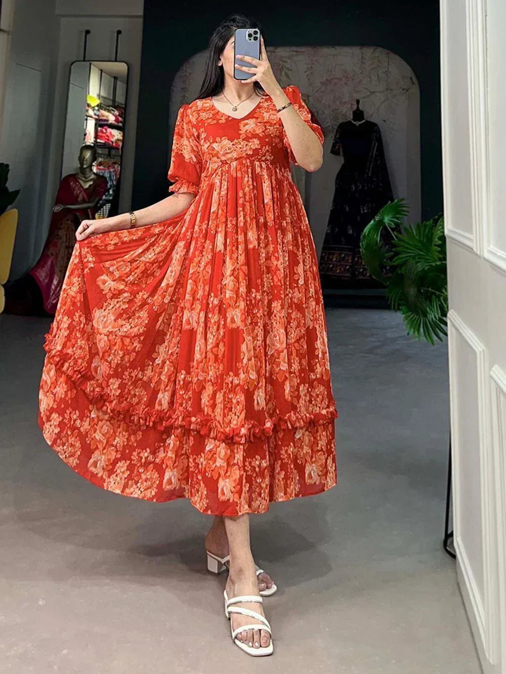 Orange floral ethnic gown with ruffled layers, perfect for festive occasions and Indian wear