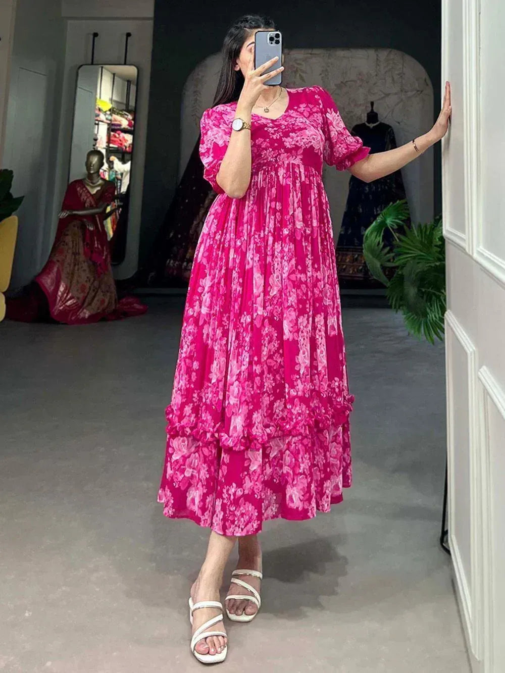 Pink floral ethnic gown with ruffled layers, perfect for Indian occasions and festive wear.