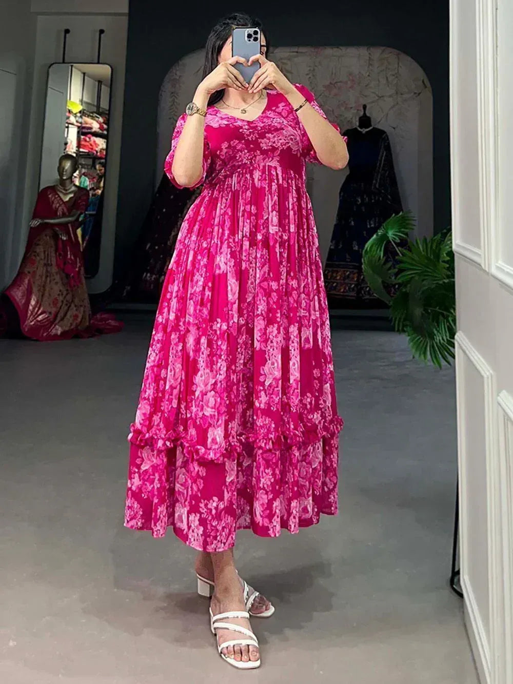 Pink floral ethnic gown with ruffled layers, perfect for Indian occasions and festive wear.