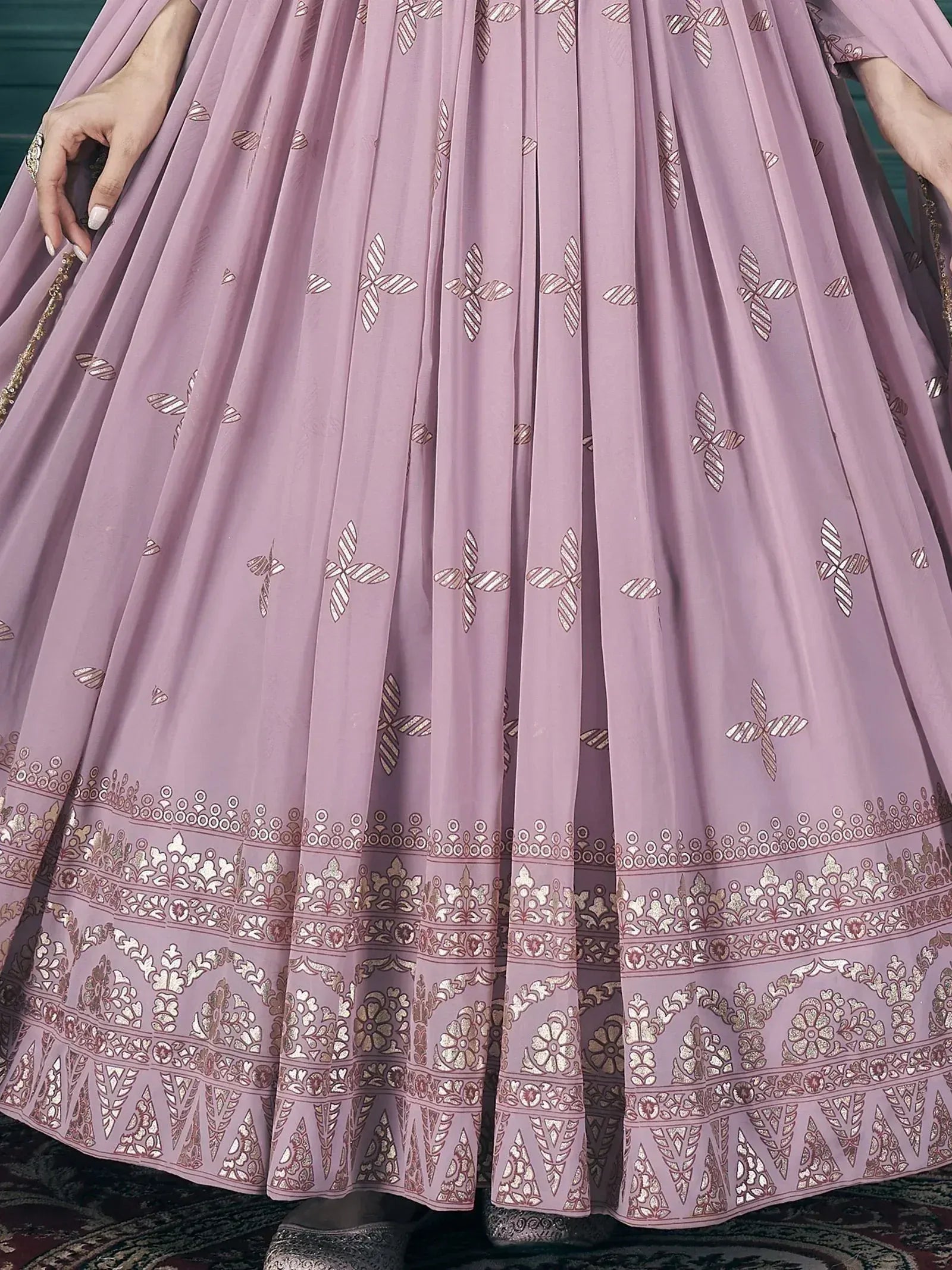 Pink designer lehenga with gold floral embroidery and pleated skirt, ethnic Indian wear