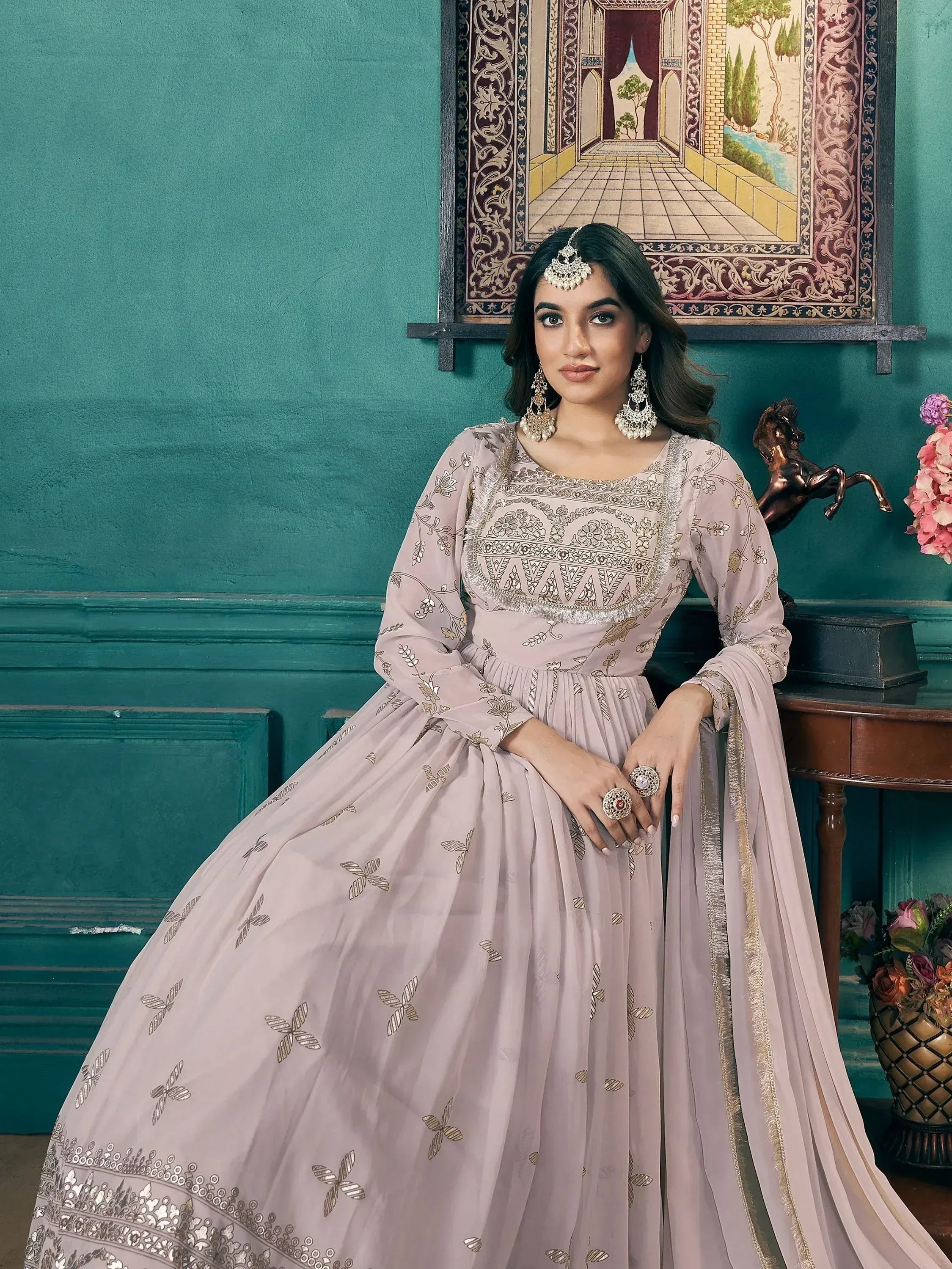 Elegant Indian ethnic gown with gold embroidery, perfect for weddings and festive occasions.