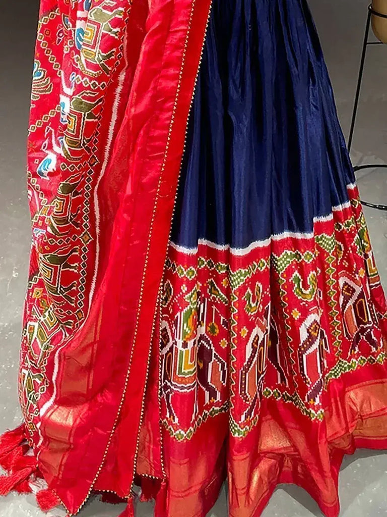 Tremendous Blue Patola Print Dola Silk Party Wear Gown