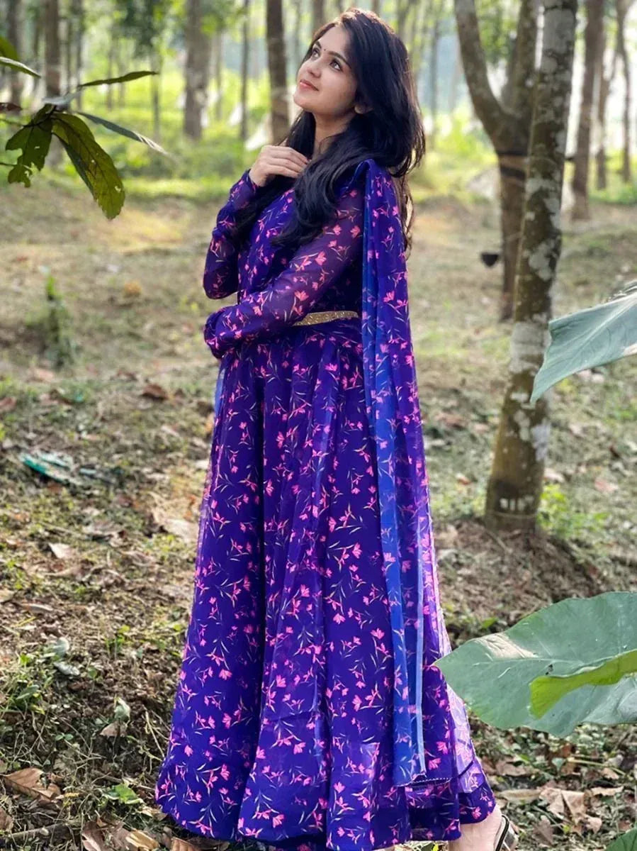 Purple floral ethnic gown with sheer sleeves and dupatta, perfect for Indian occasions