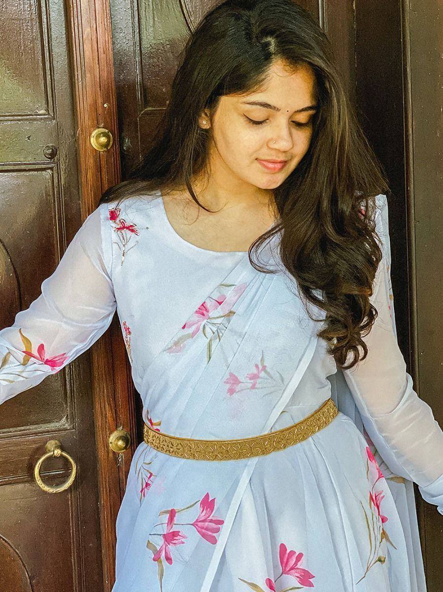 Light blue floral printed ethnic gown with gold belt, perfect for Indian occasions