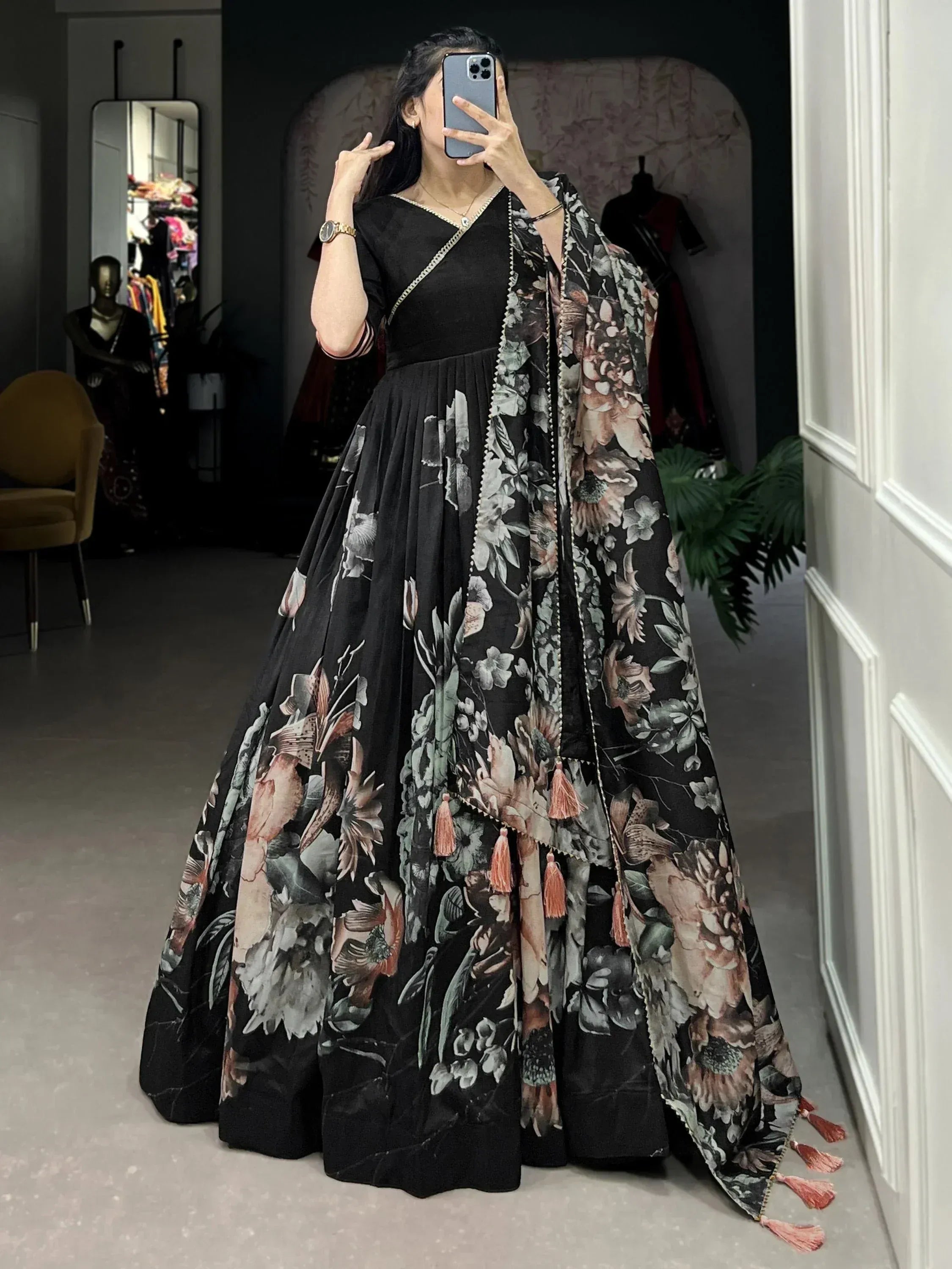 Black floral print ethnic gown with tassel dupatta, perfect for Indian occasions and festive wear.