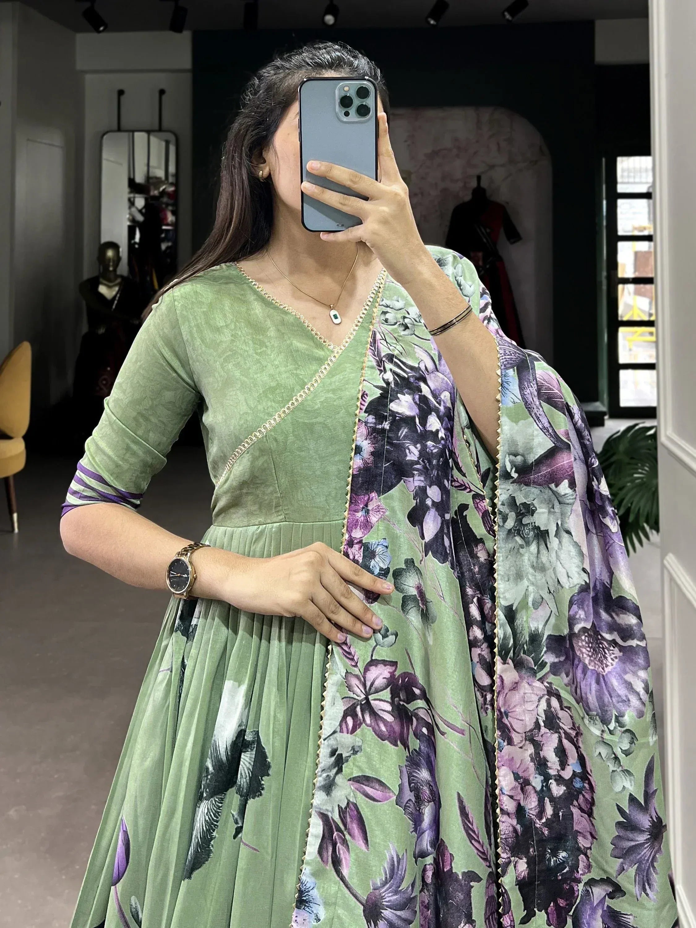 Green floral print ethnic gown with gold trim, perfect for Indian occasions and festive wear