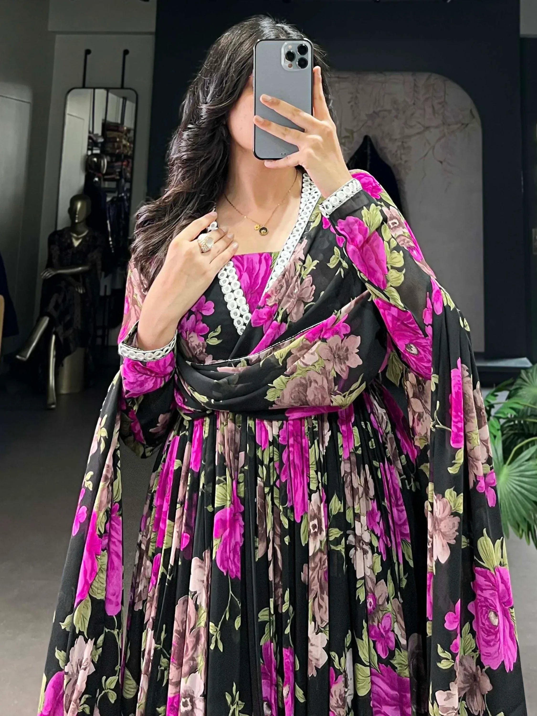 Black floral ethnic gown with pink blooms and white trim, perfect for Indian occasions