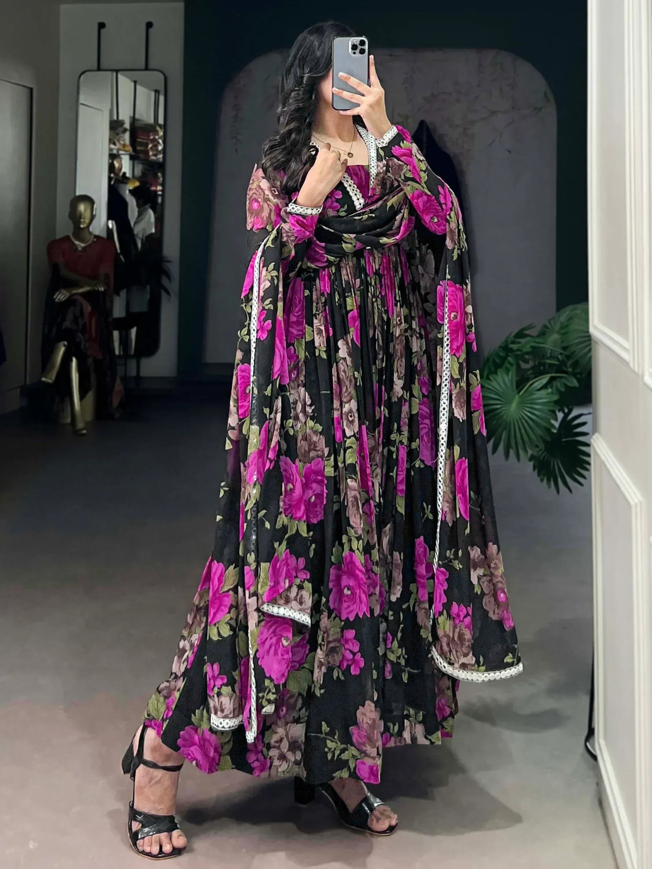 Black and pink floral ethnic gown with white lace trim, perfect for Indian occasions