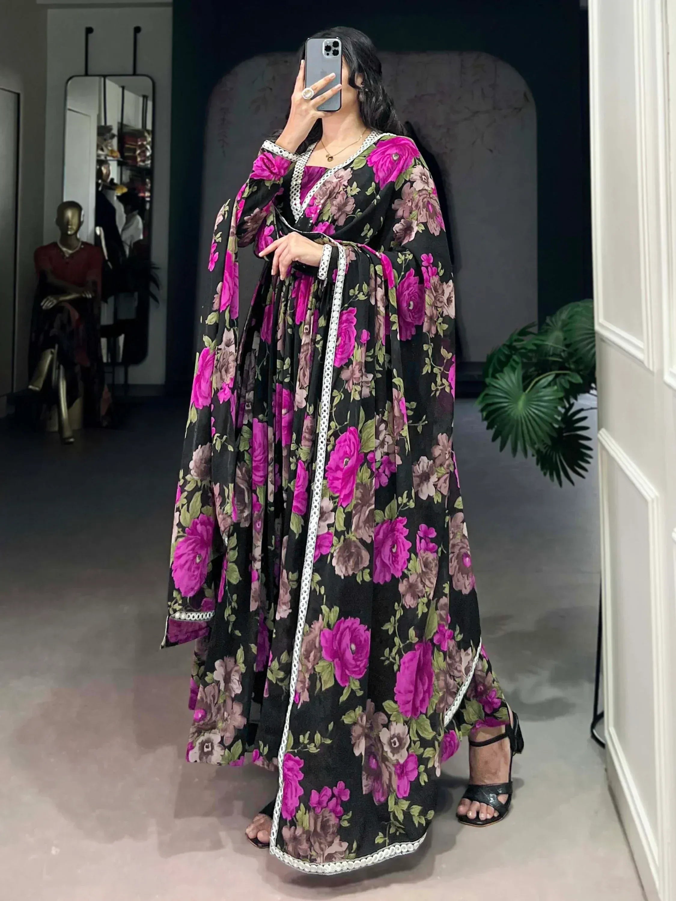 Black floral ethnic gown with pink roses and white trim, perfect for Indian occasions