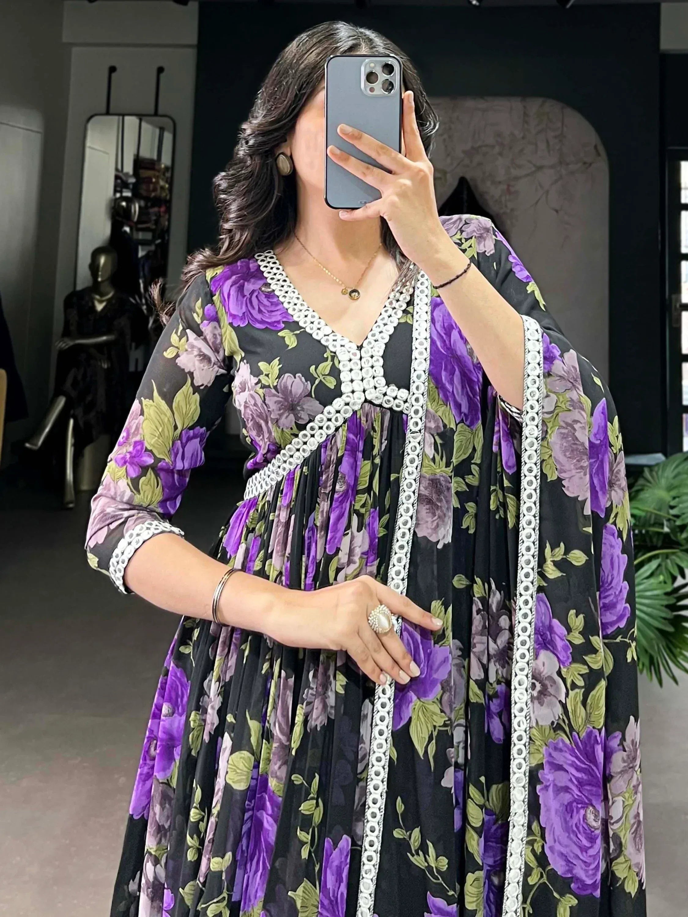Purple floral ethnic gown with white embroidery, perfect for Indian occasions and parties.
