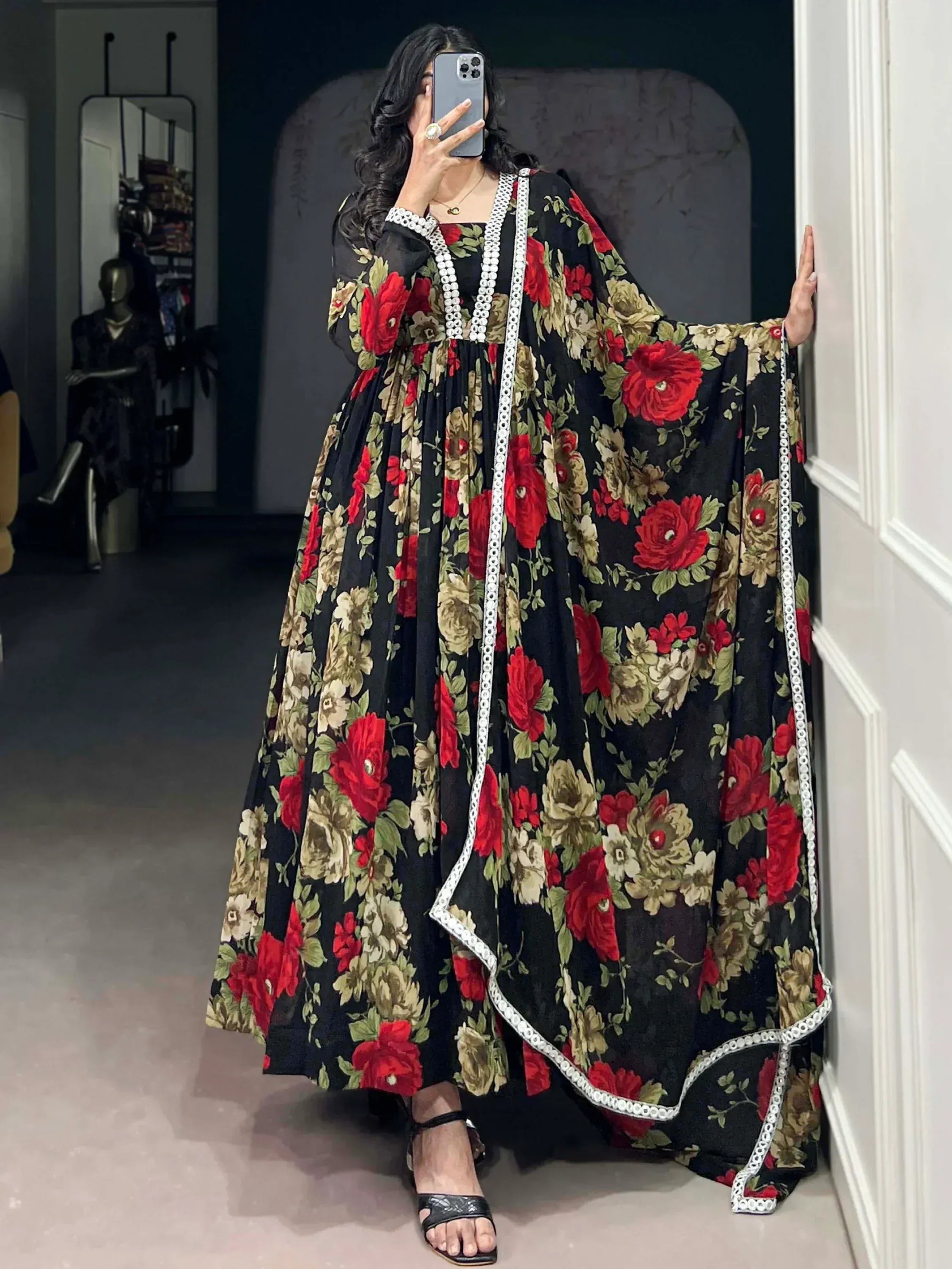 Black floral ethnic gown with red roses and white trim, perfect for Indian occasions
