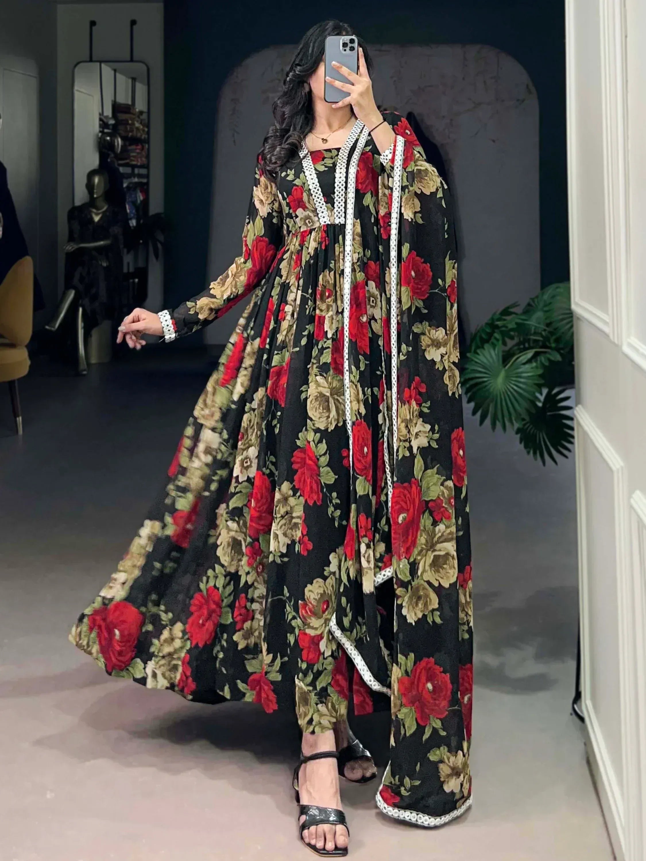 Black floral ethnic gown with red roses and white lace trim, perfect for Indian occasions
